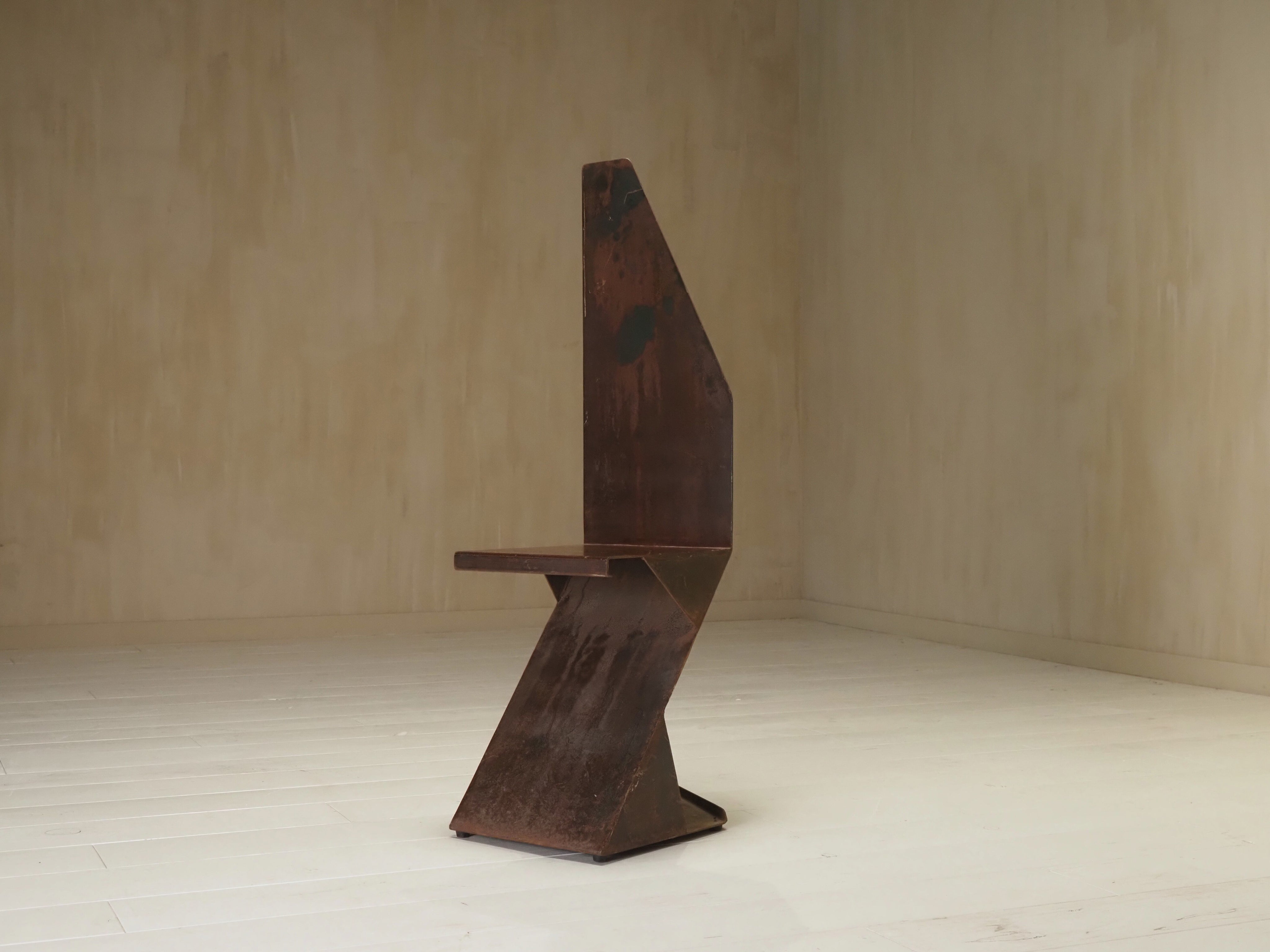 Sculptural postmodernism steel chair — lifestyle setting