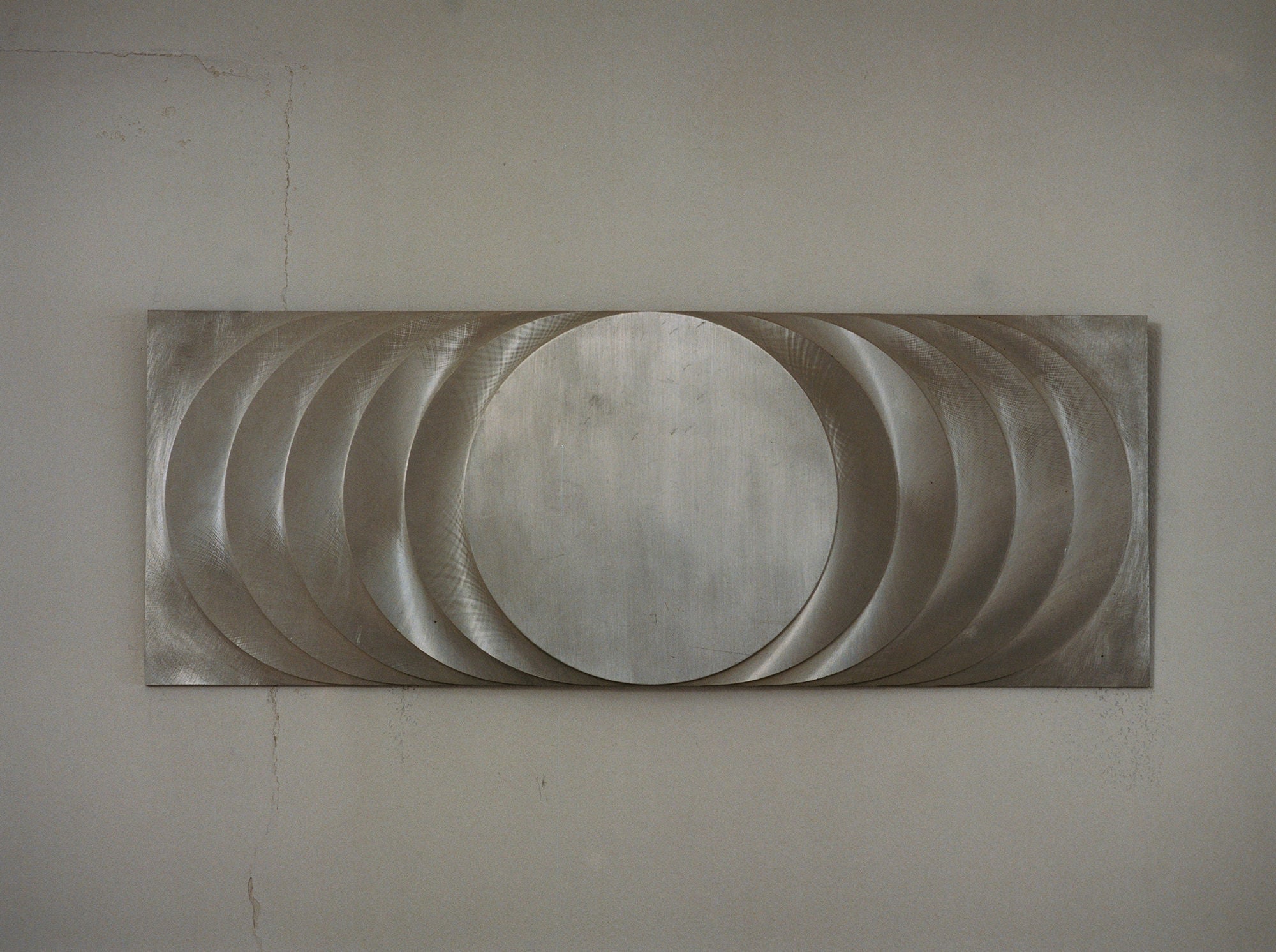 ‘The Sun’s Path' Steel Wall Sculpture By Anonymous French Artist Circa 1970 — close-up of brushed steel surface