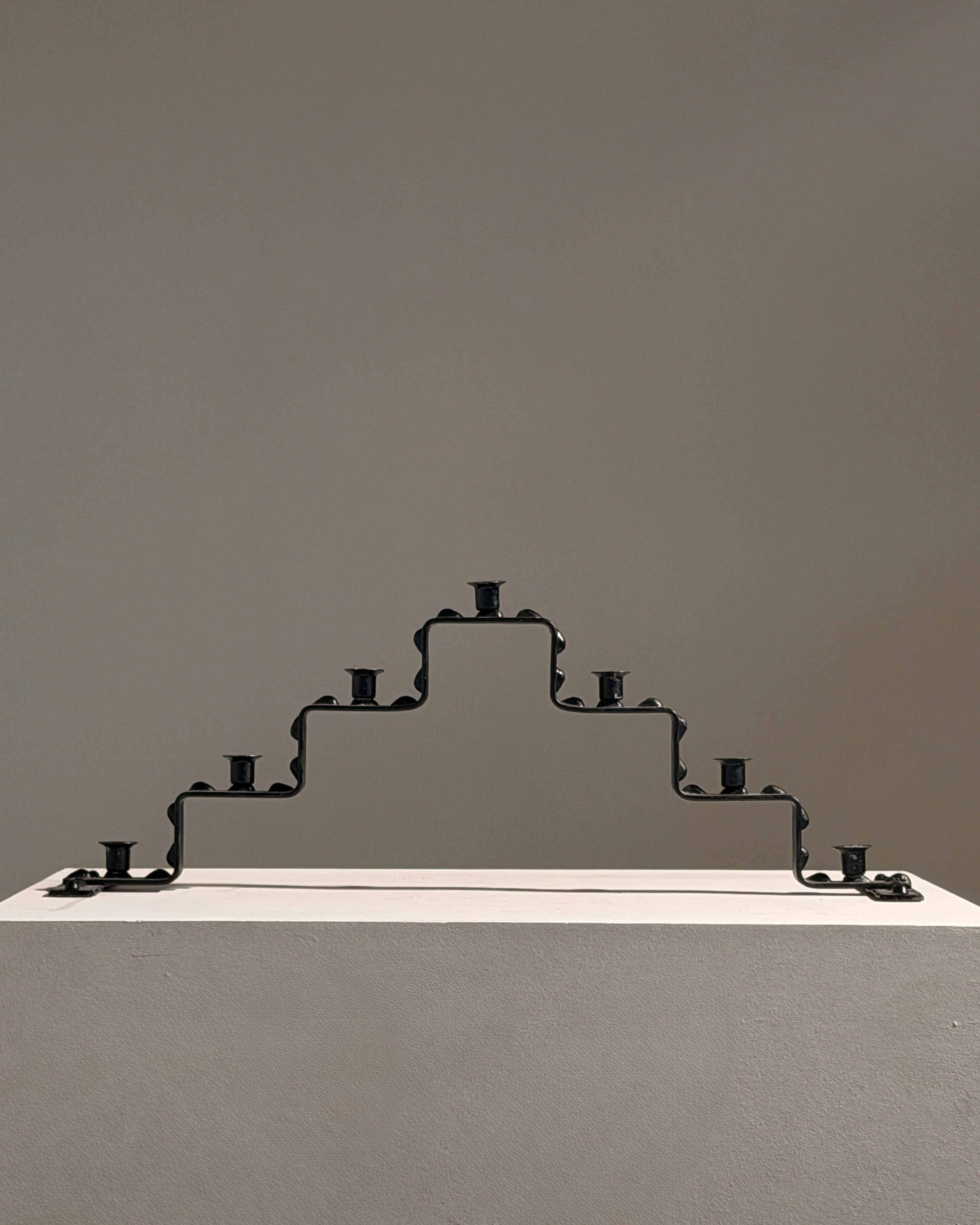 Seven-light geometric candelabra in black iron, circa 1960 by Figuresdesign | The Oblist
