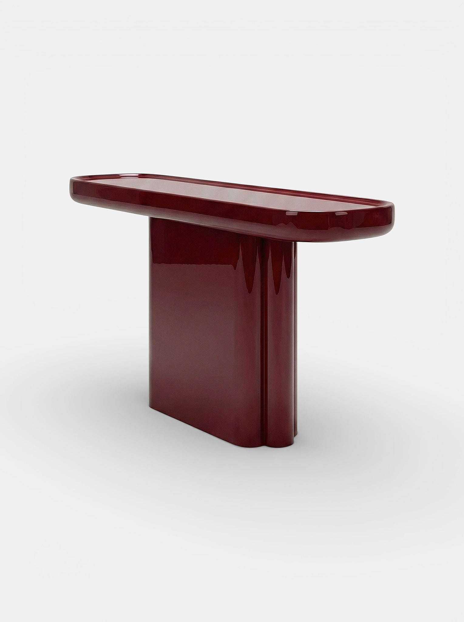 Ugo Bordeaux Lacquered Wood Console — close-up of glossy burgundy finish