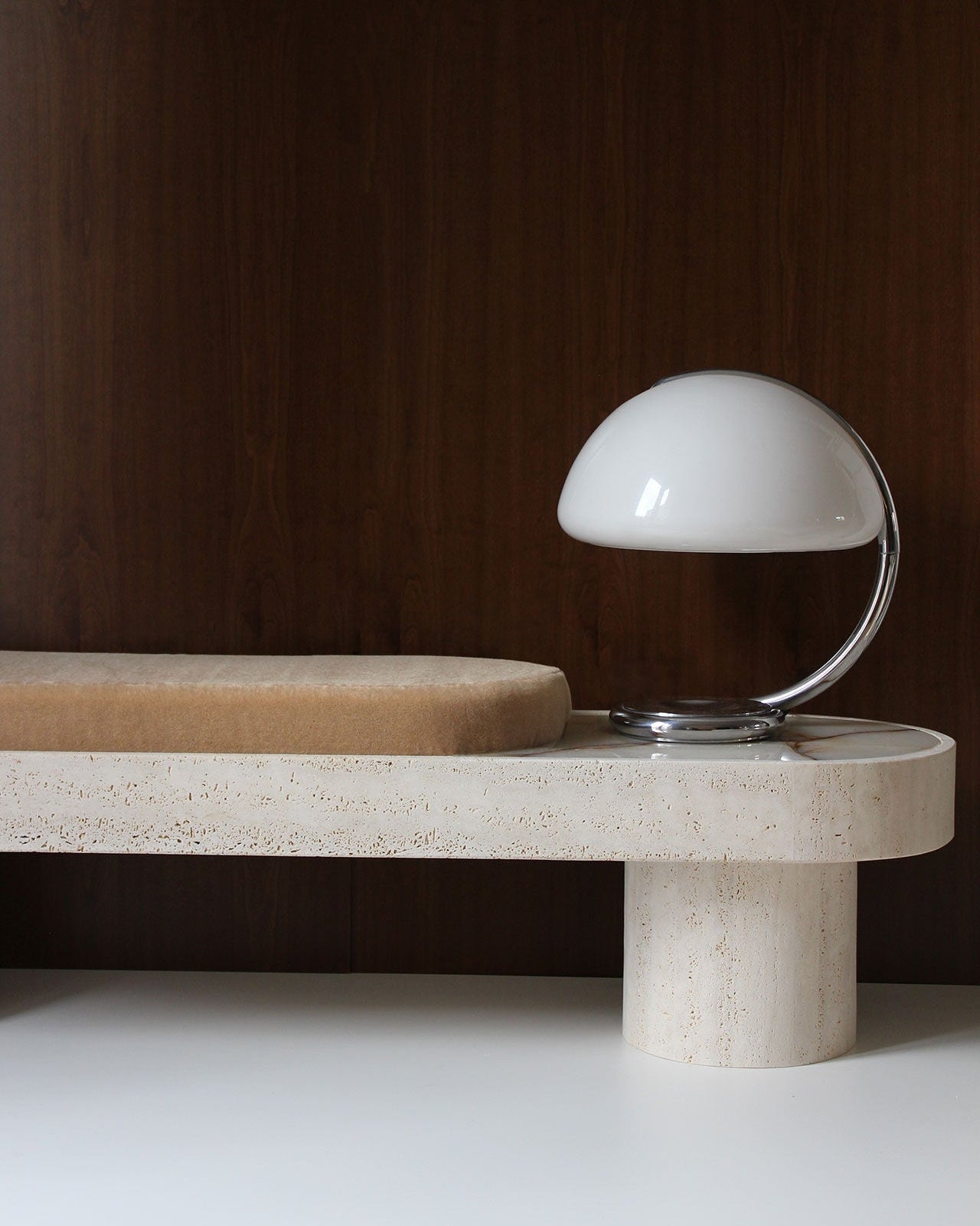 Noto Bench — side view with beige cushion and round lamp