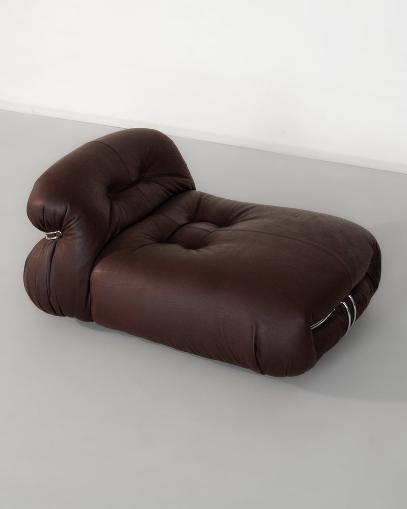 Brown leather Soriana lounge chair showing tufted upholstery detail