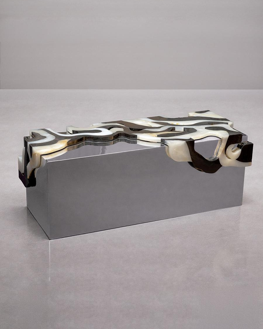 Orbis Bench II — close-up of polished metal surface with organic design