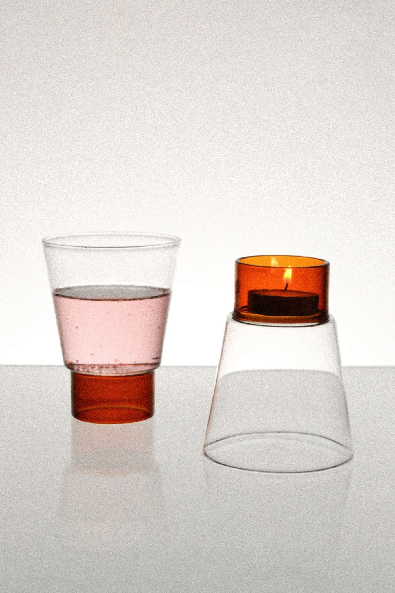 Podio' Glass - Amber — top view of amber glass with candle