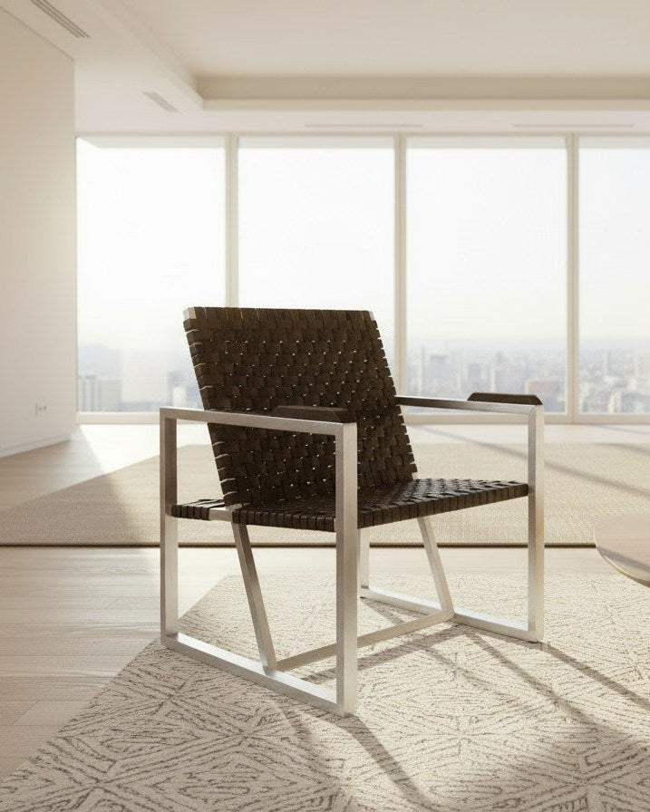 RIA II Lounge Chair — angled view with woven leather seat in modern setting