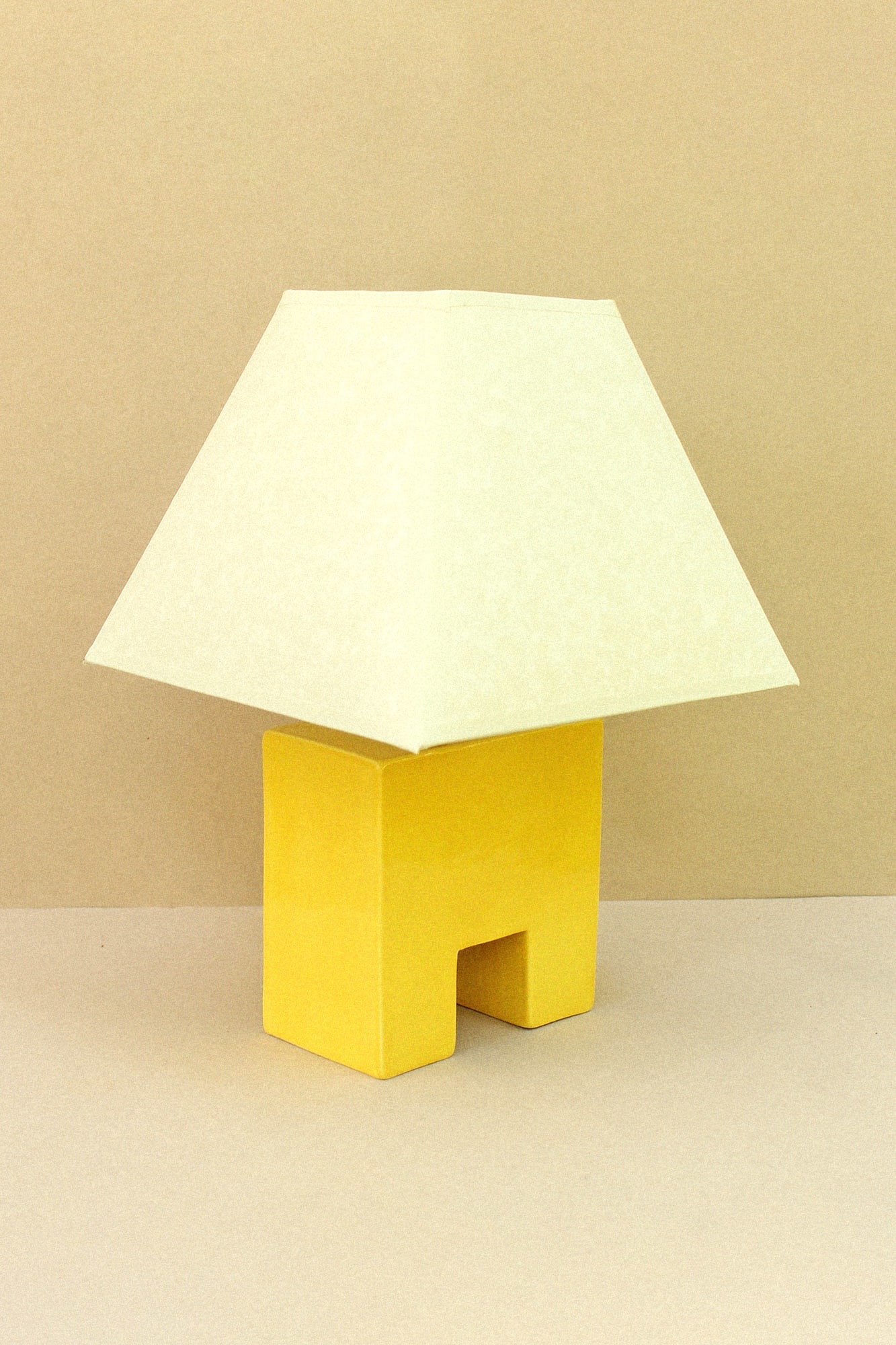 Cristo Lamp (Sol) — close-up of yellow ceramic base and shade