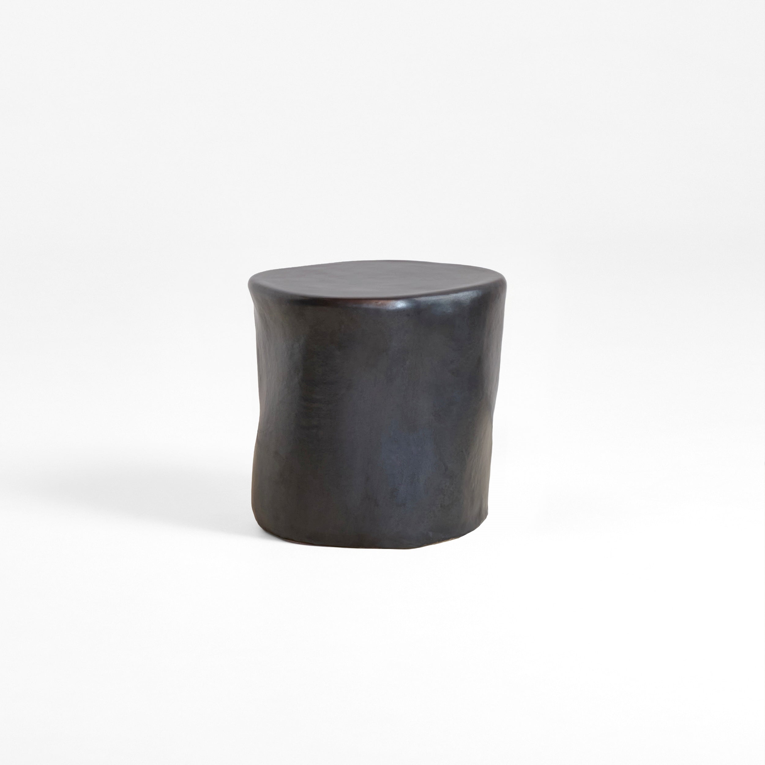 Ceramic Side Table (small) — back view of black ceramic surface