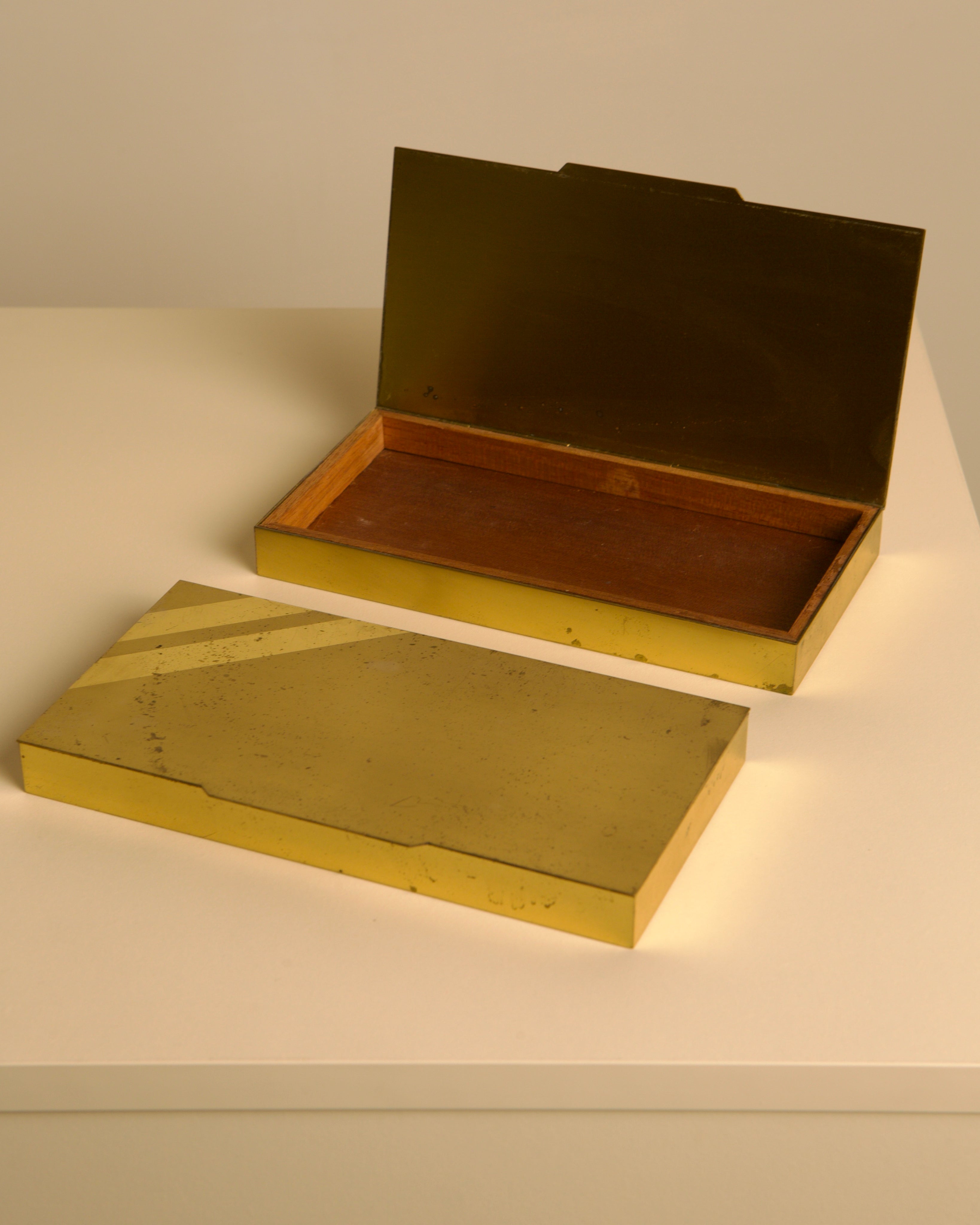Open vintage Italian brass and wood box showing interior compartments