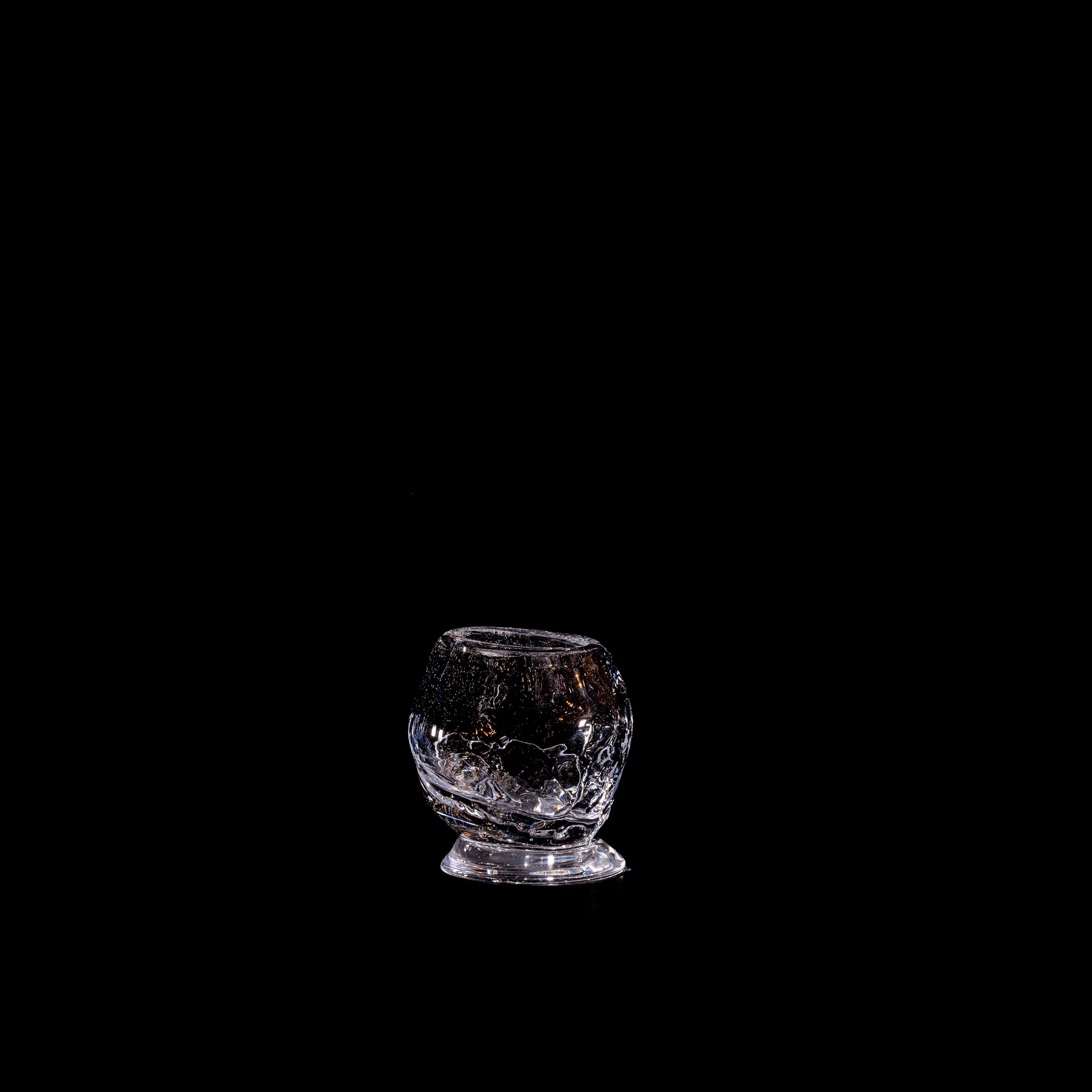 Organic Round Table Glass — side angle on black background