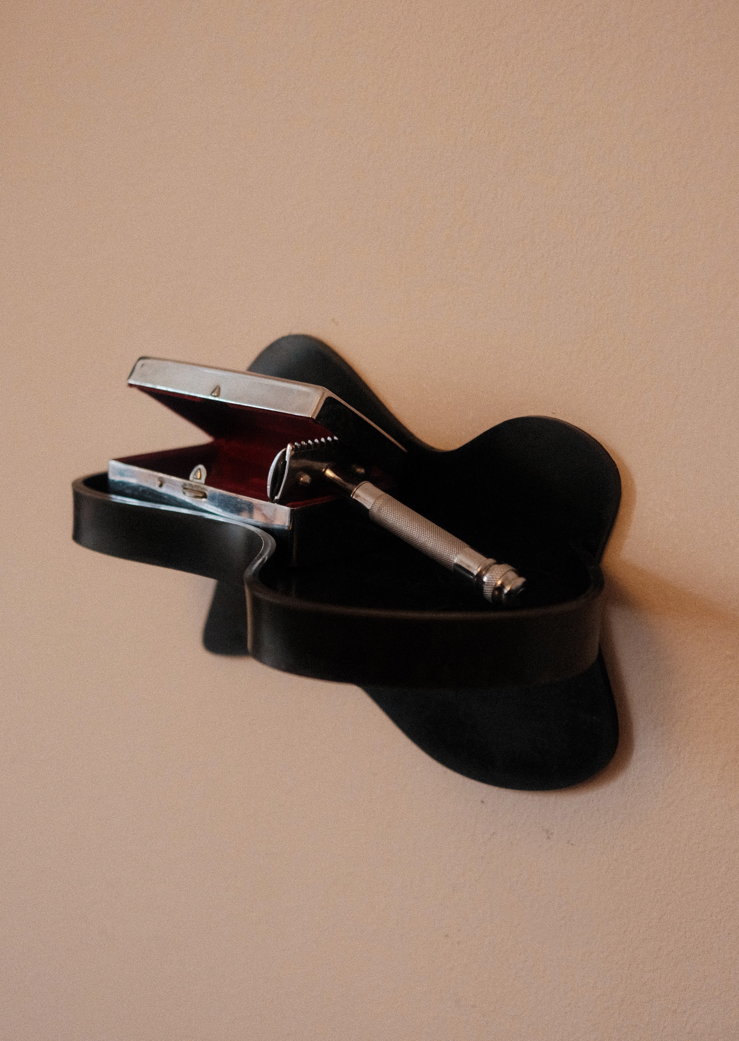 Small Shelf — top view of black wall-mounted design with items