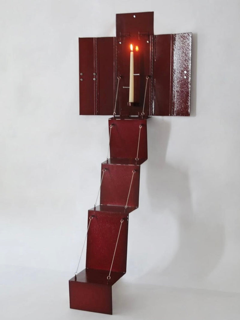 Wax Clock' Wall Candleholder — close-up of red metal structure with candle