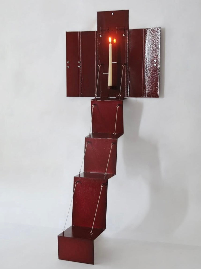 Wax Clock' Wall Candleholder — close-up of red metal structure with candle