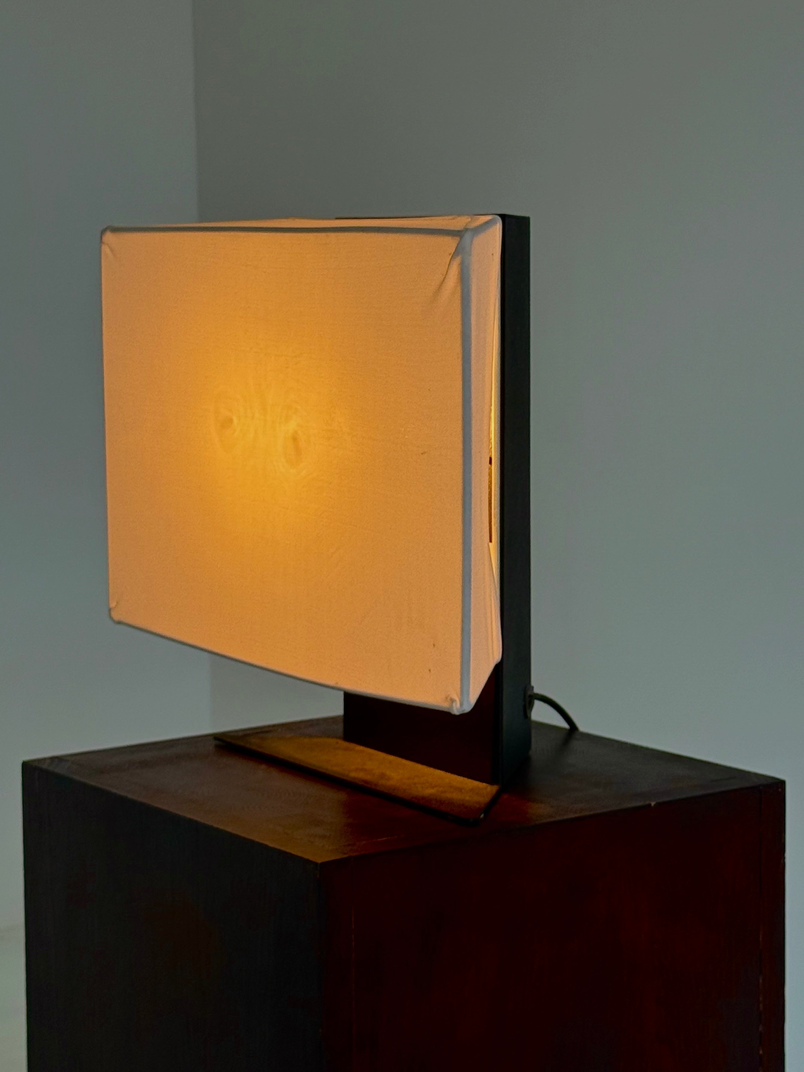 Accademia table lamp by Cini Boeri for Artemide — lifestyle setting