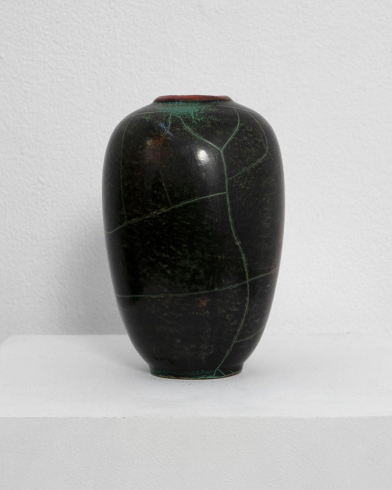 Dark green ceramic vase with natural veining by Richard Uhlemeyer