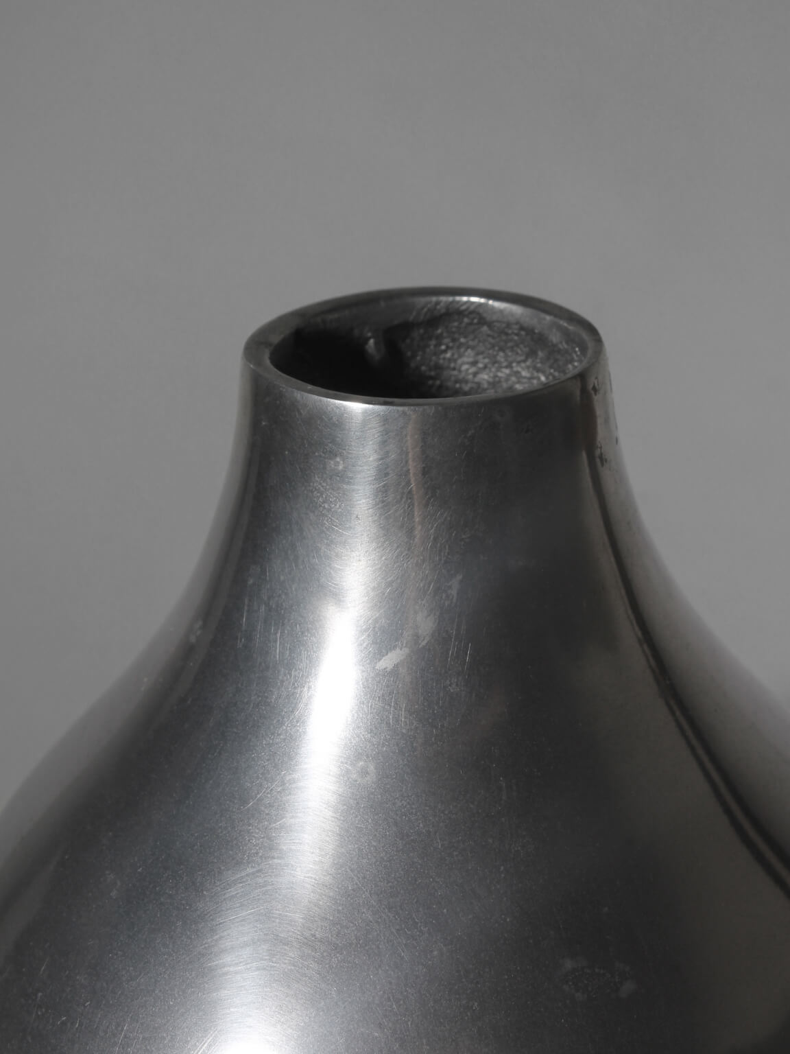 Polished Aluminum Bulbous Vase — side angle