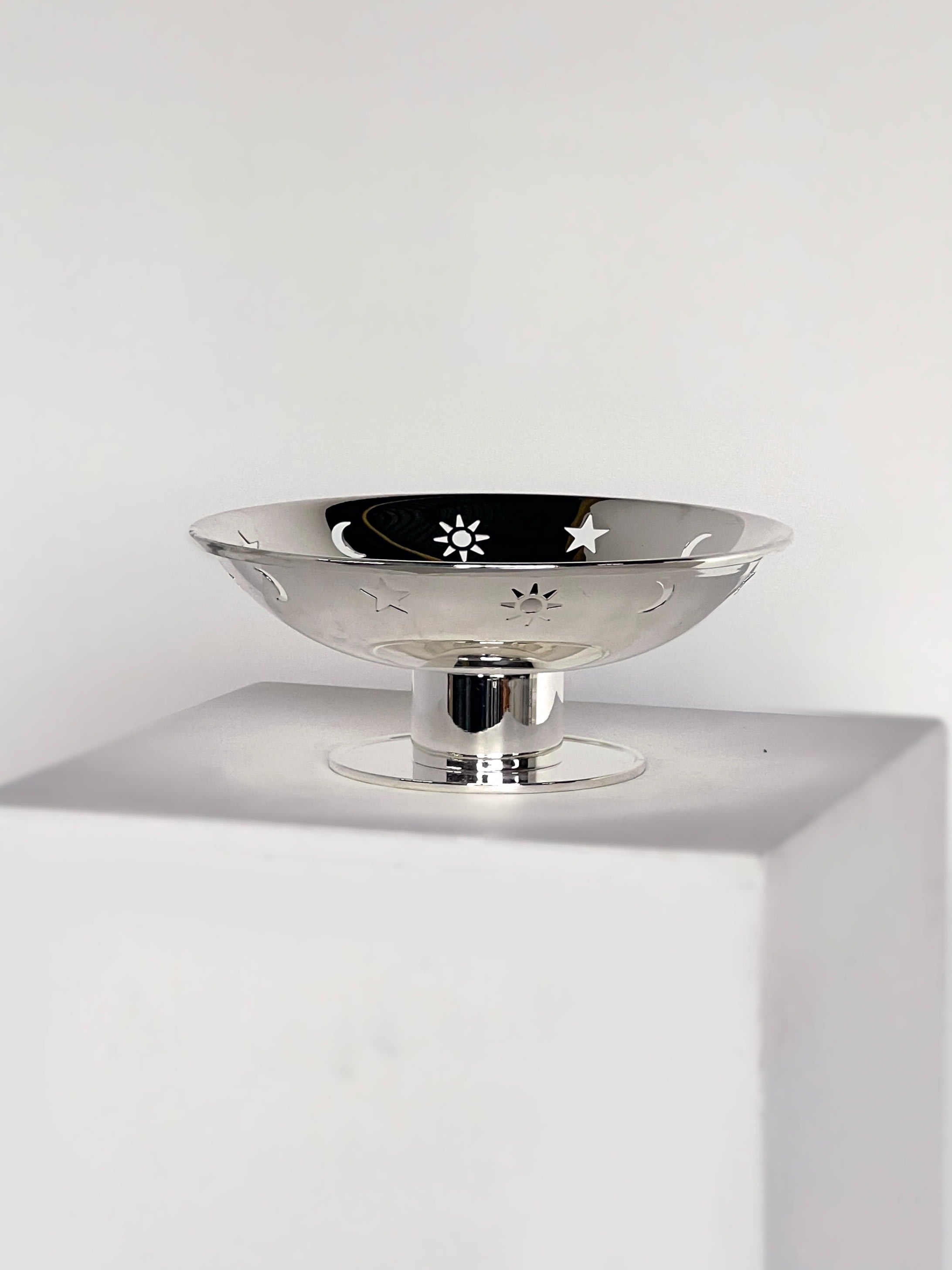 Star, sun, moon dish on pedestal  — detail view