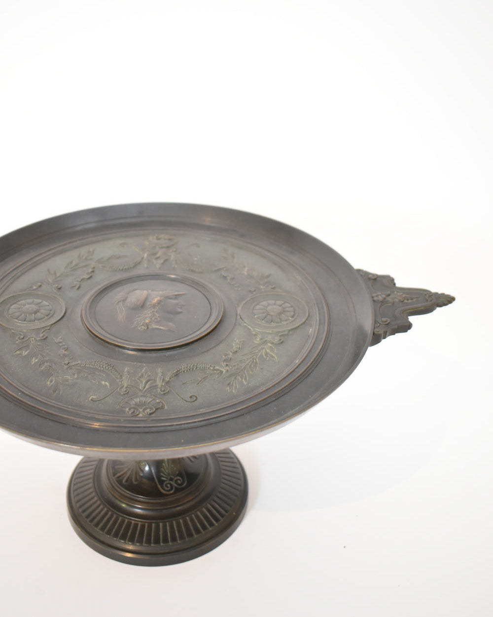 The Barbedienne Style Pedestal Cup, XIXth c. by Barracuda Interiors features ornate dark metal with engraved floral patterns and a decorative side handle, shown against a plain white background.