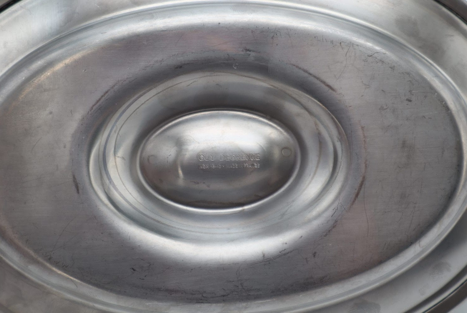 Vintage Guy Degrenne Stainless Steel Gravy Boat with Fixed Saucer (c. 1970) — close-up