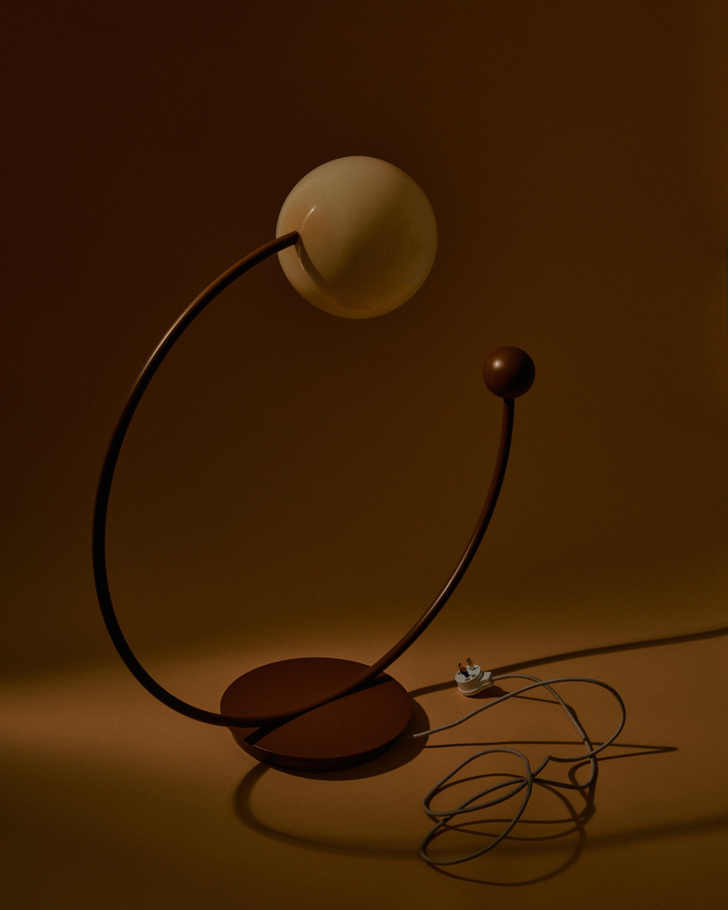 Oro Table Lamp w/ Handblown Glass — side angle showing brown base and glass globe