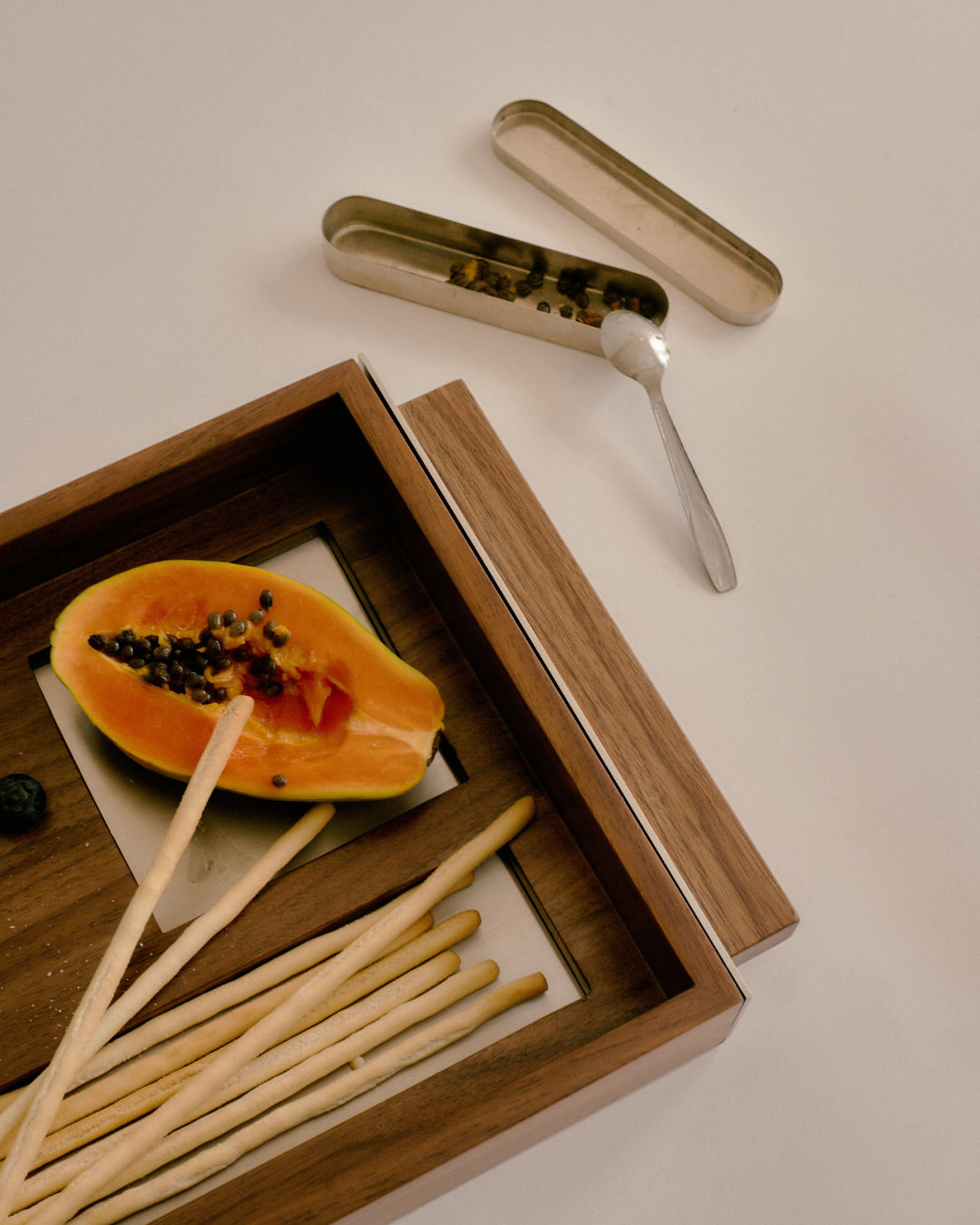 T4 wooden tray lifestyle view with papaya and wooden utensils