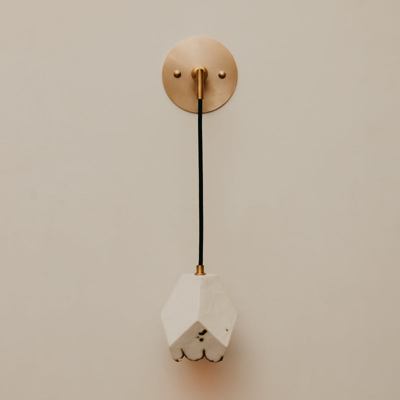 Relic Lantern Sconce — close-up of white ceramic shade and brass mount