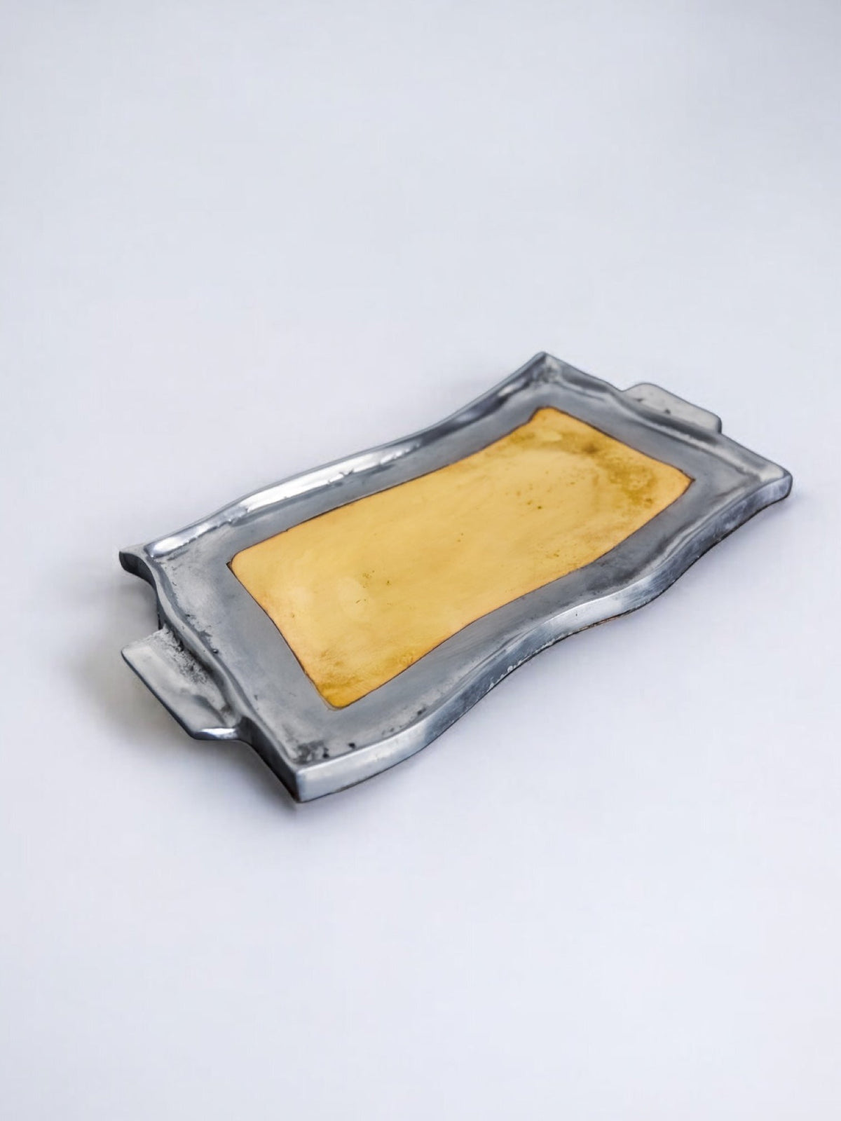 Brutalist Vide Poches by Leopold, bronze and aluminum 1970, Spain — lifestyle setting