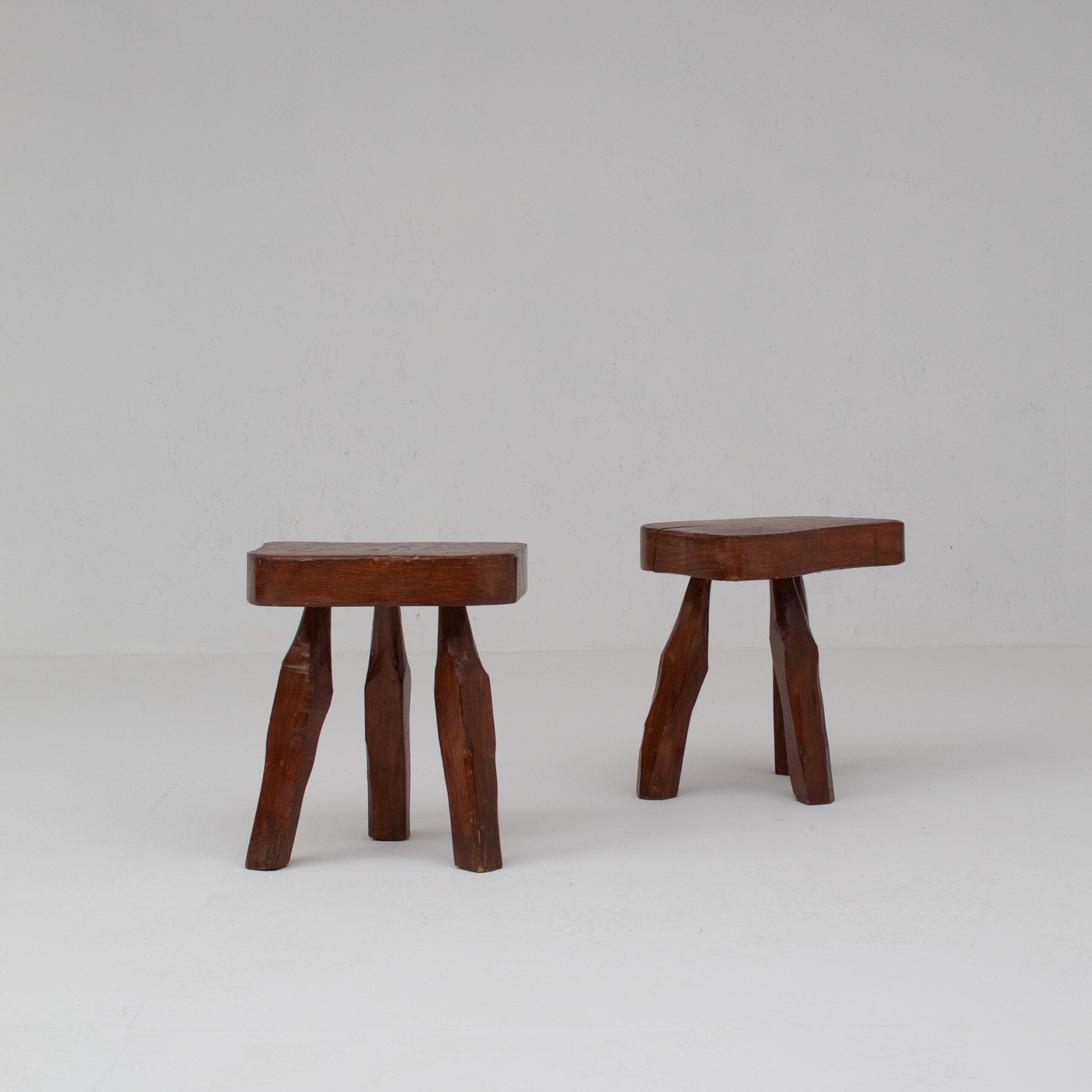 Pair of Sculptural Solid Wood Brutalist Stools, France, 1960s — lifestyle setting