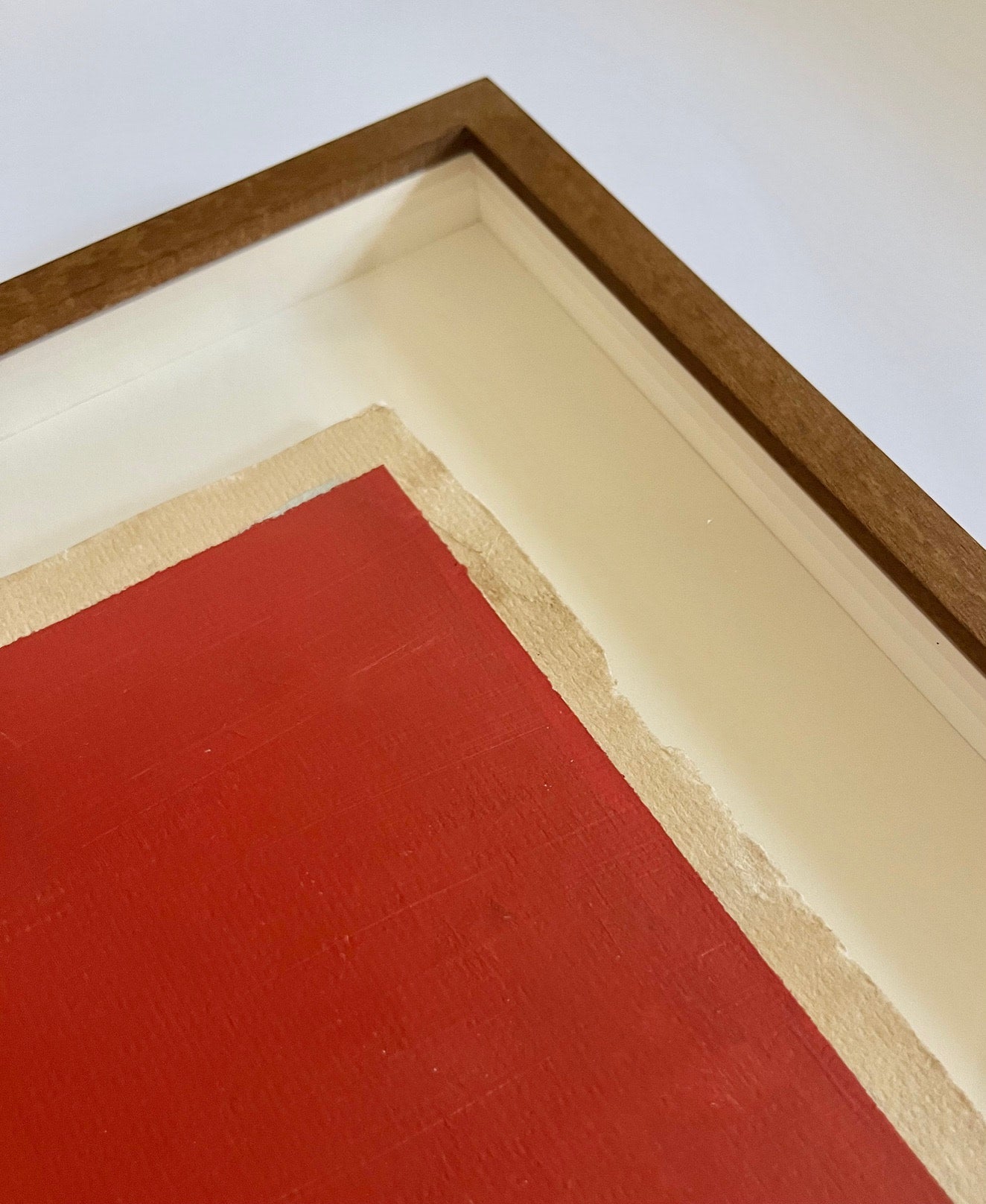 Three Layers of French Red Dye and Pigment on Aged Paper — side angle showing wooden frame and textured paper