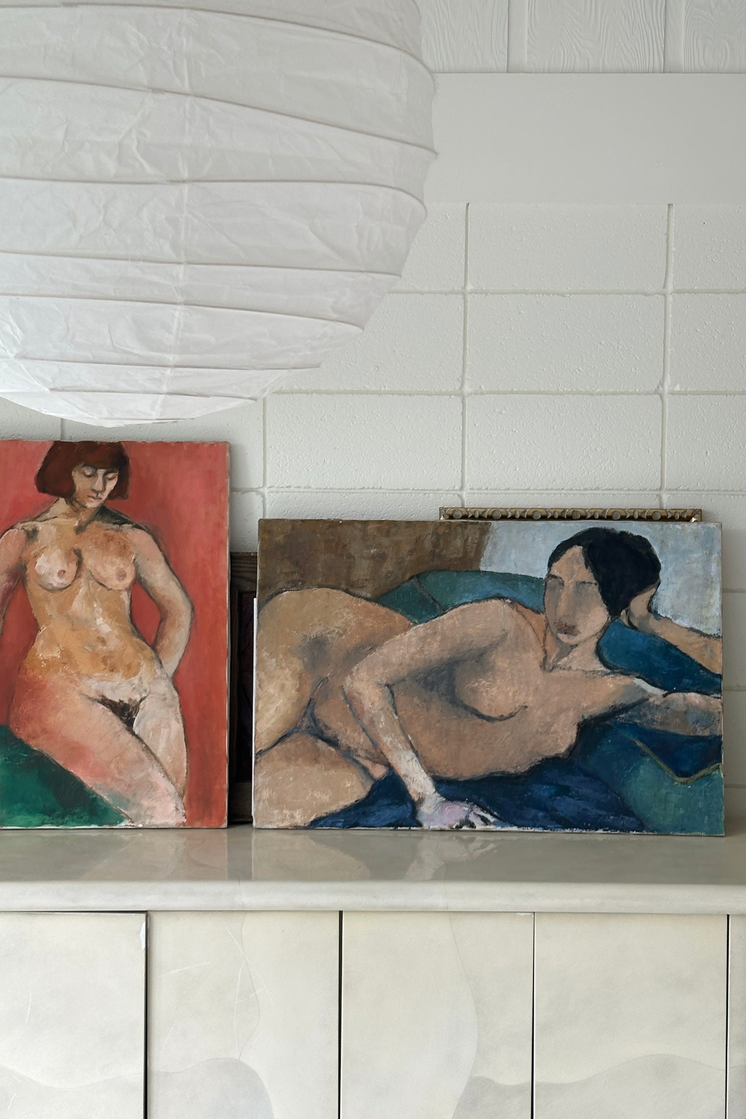 Red Nude, Original Painting by Sandra Orlovsky — displayed on light marble surface in modern setting