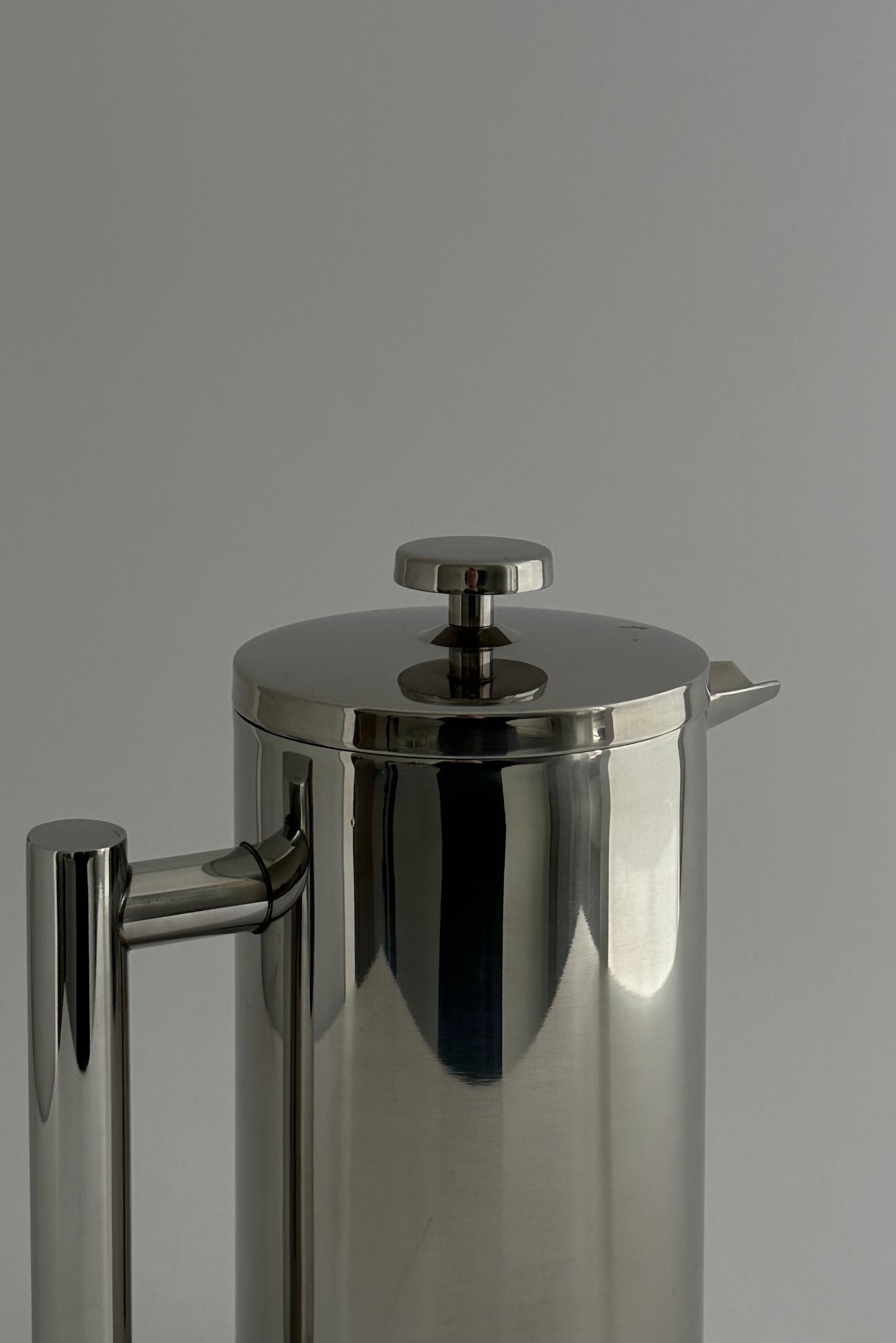 HEDONISM' stainless steel french press — top view highlighting polished surface