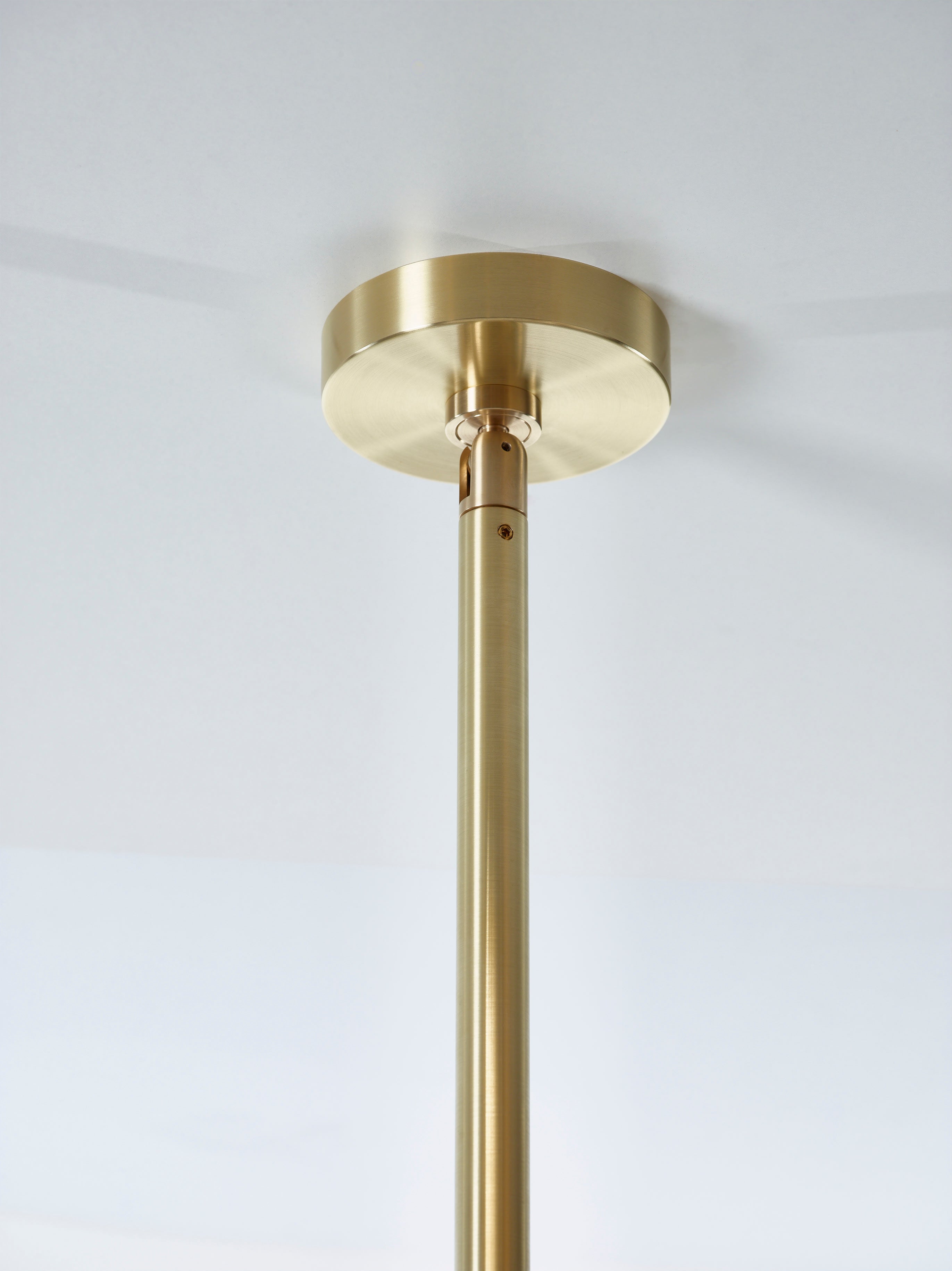SkLO Angle 3.0 Pendant - White glass, Brushed Brass finish — lifestyle setting