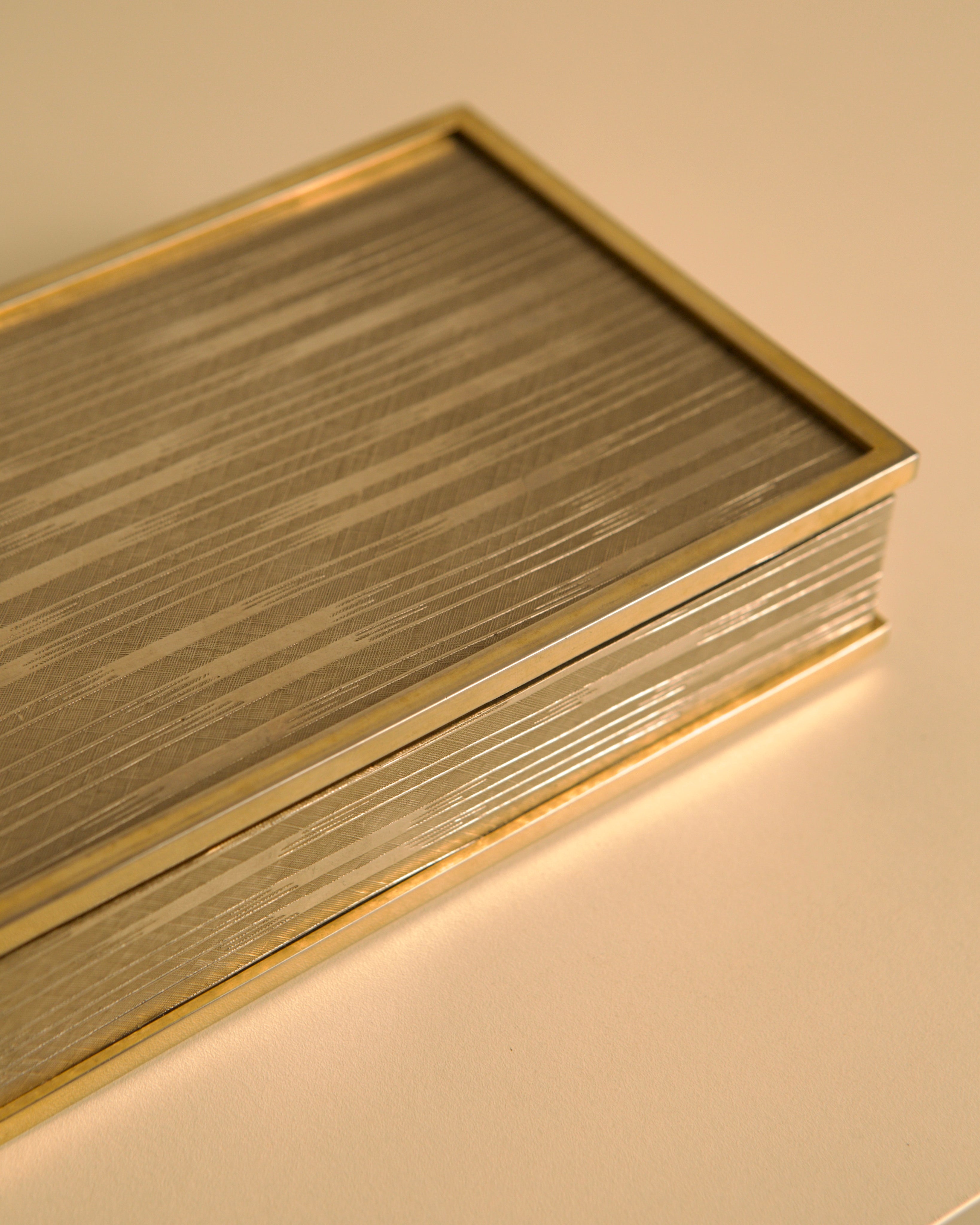 Italian Art Deco Box in Cut Metal and Brass, 1930s — angled view highlighting textured metal surface