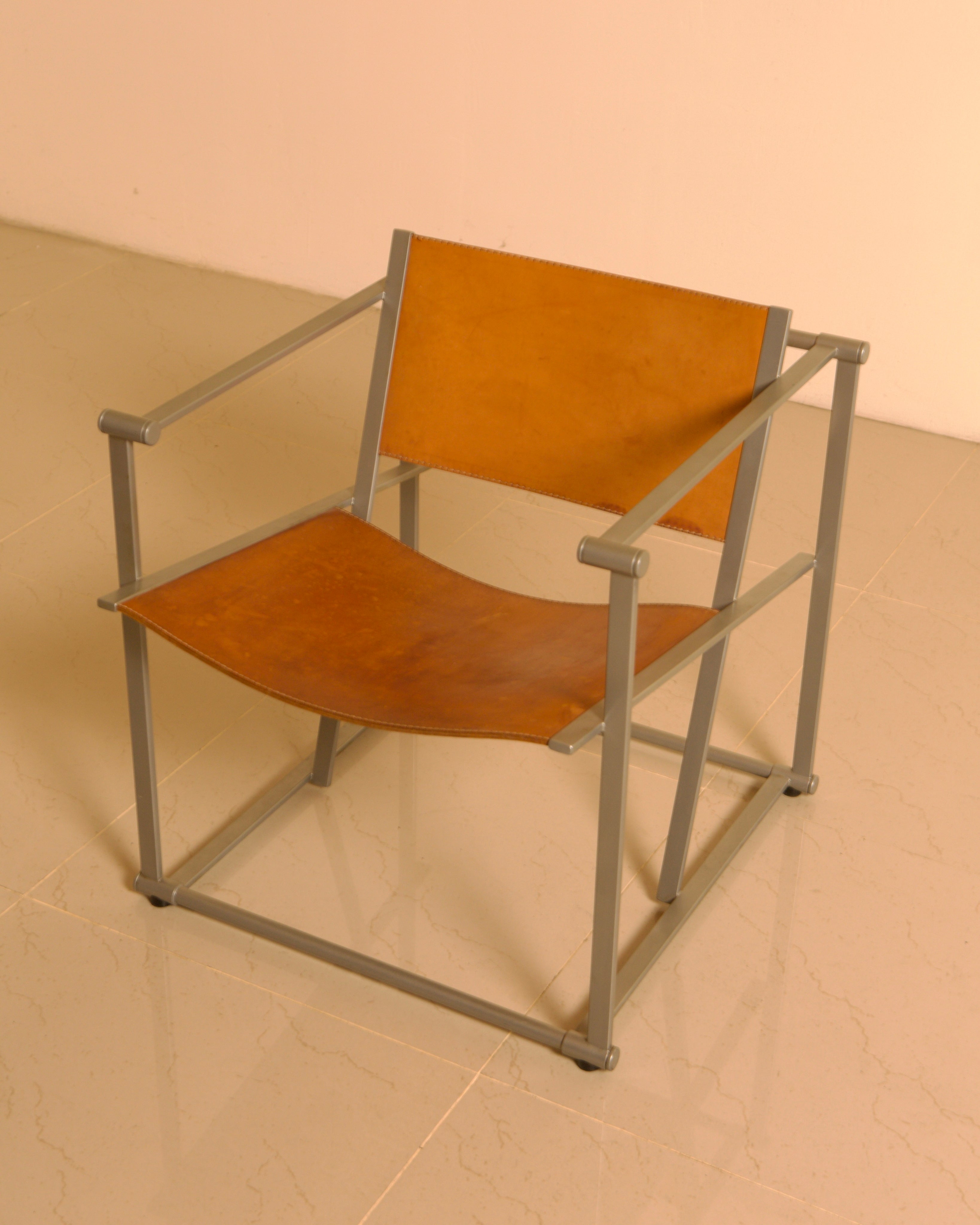 Pair of "FM62" Armchairs by Radboud van Beekum for Pastoe, 1980s — side angle showing leather seat and metal frame