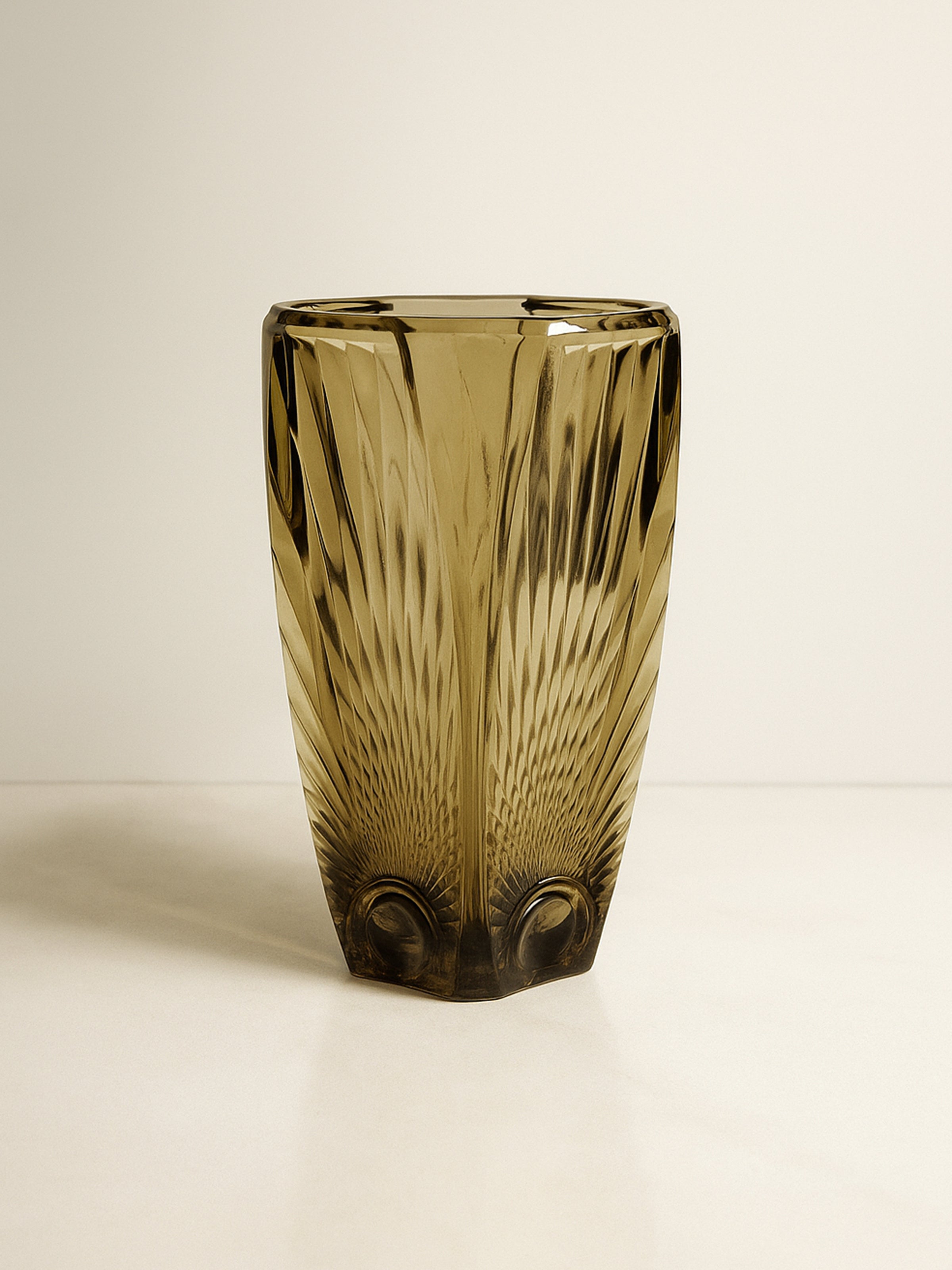 The Art Deco Smoked Glass Vase - 1930s by Dodo Vintage features a brown, textured geometric design and wide opening, showcased on a light surface with a neutral background.