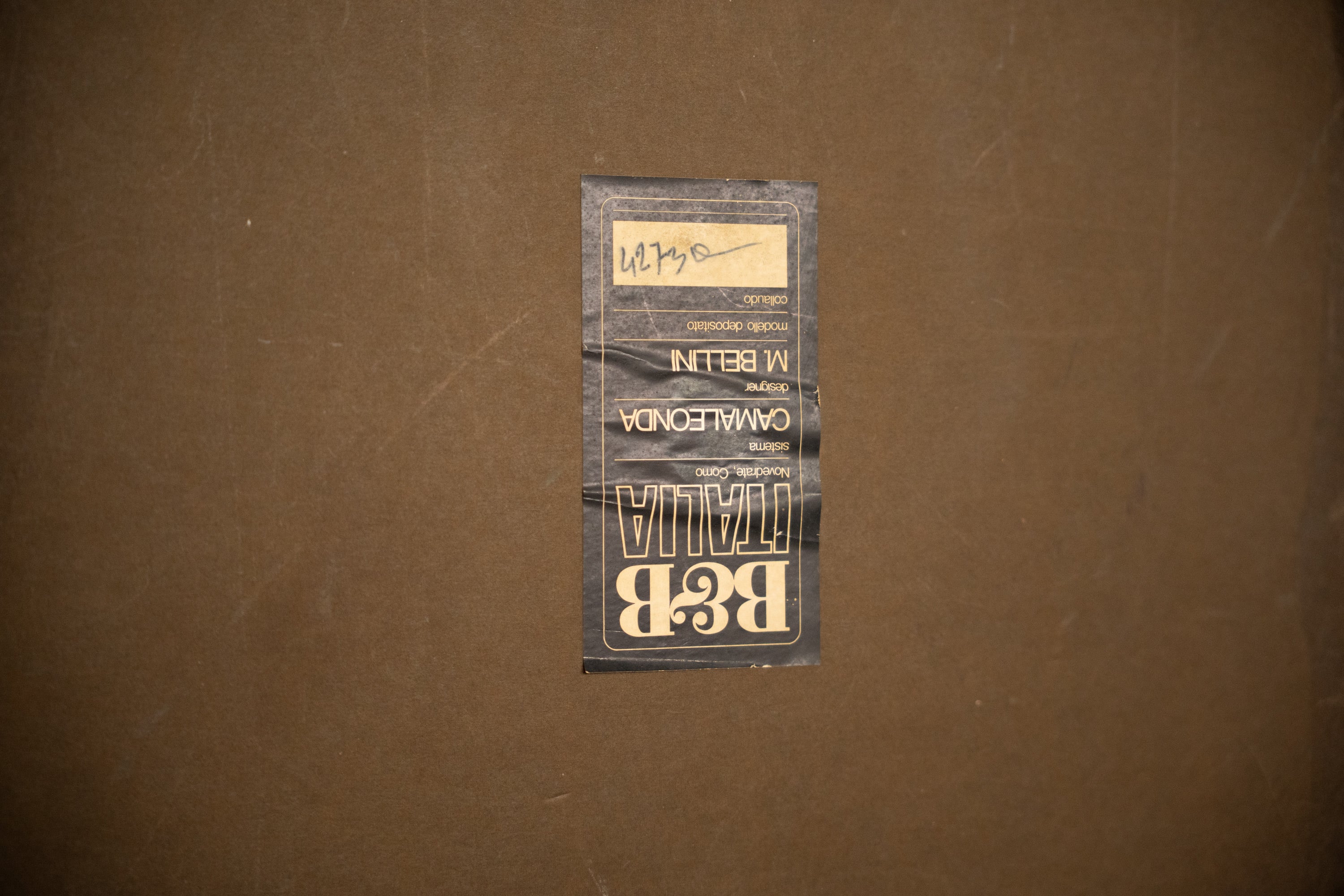 Camaleonda Modular Sofa by Mario Bellini for B&B Italia — close-up of fabric label on brown background