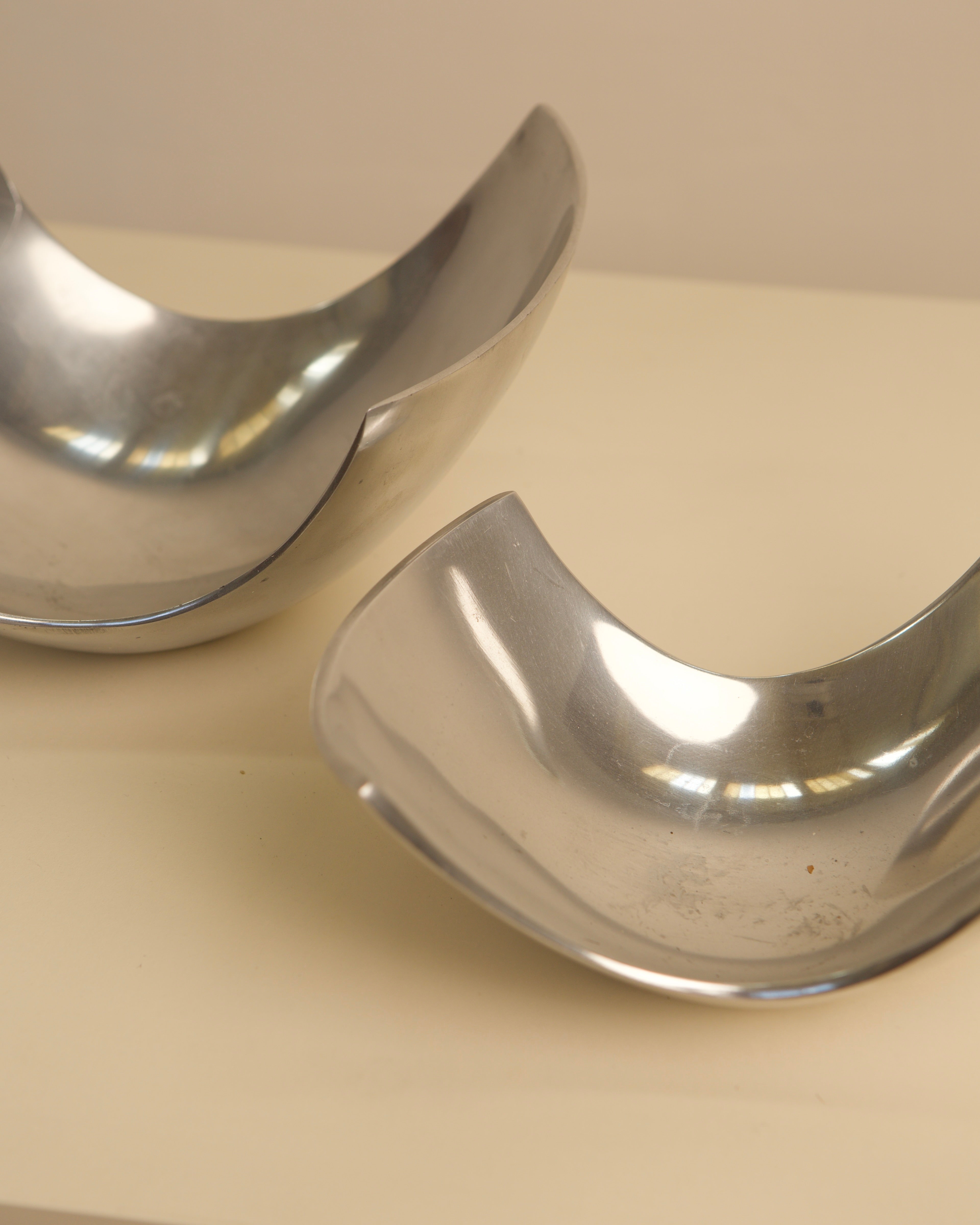 Close-up detail of polished Italian fruit baskets showing curved forms