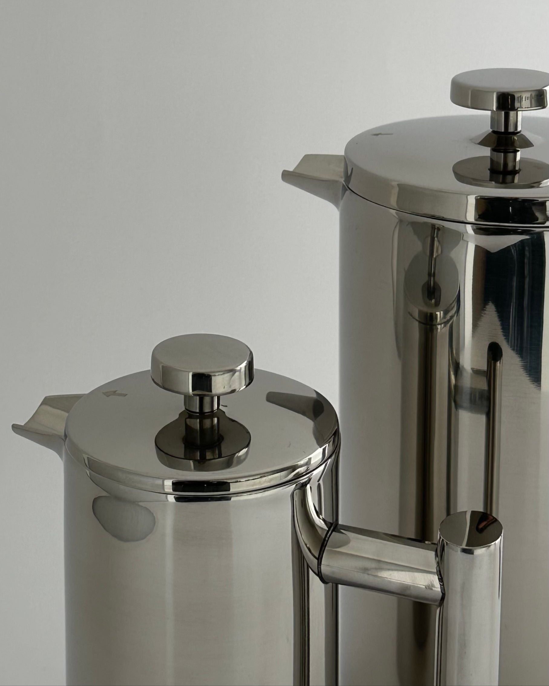 HEDONISM' stainless steel french press — close-up of polished surface and lid