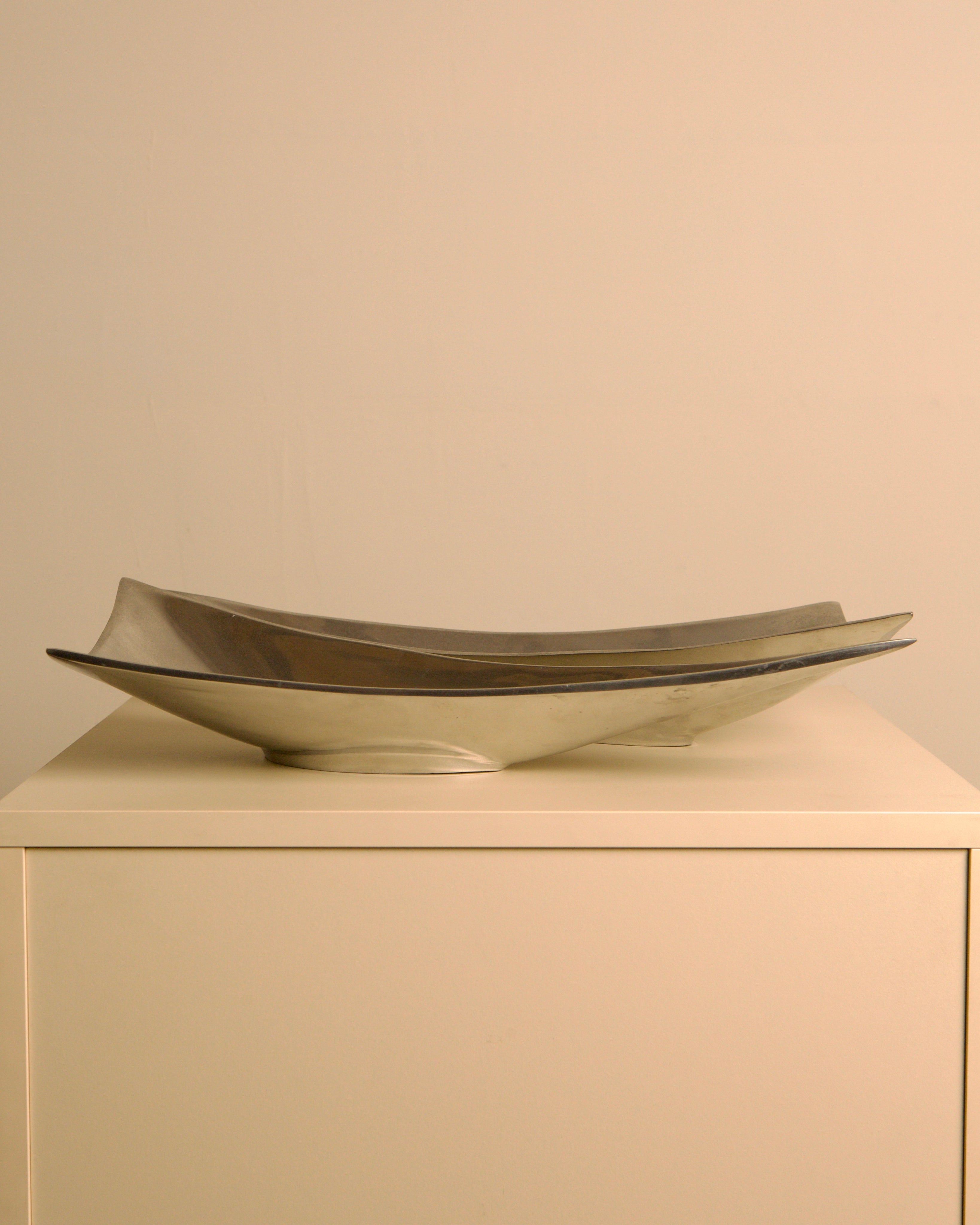 Pair of Italian "Triangle" aluminium catch-alls, 1980s — side angle