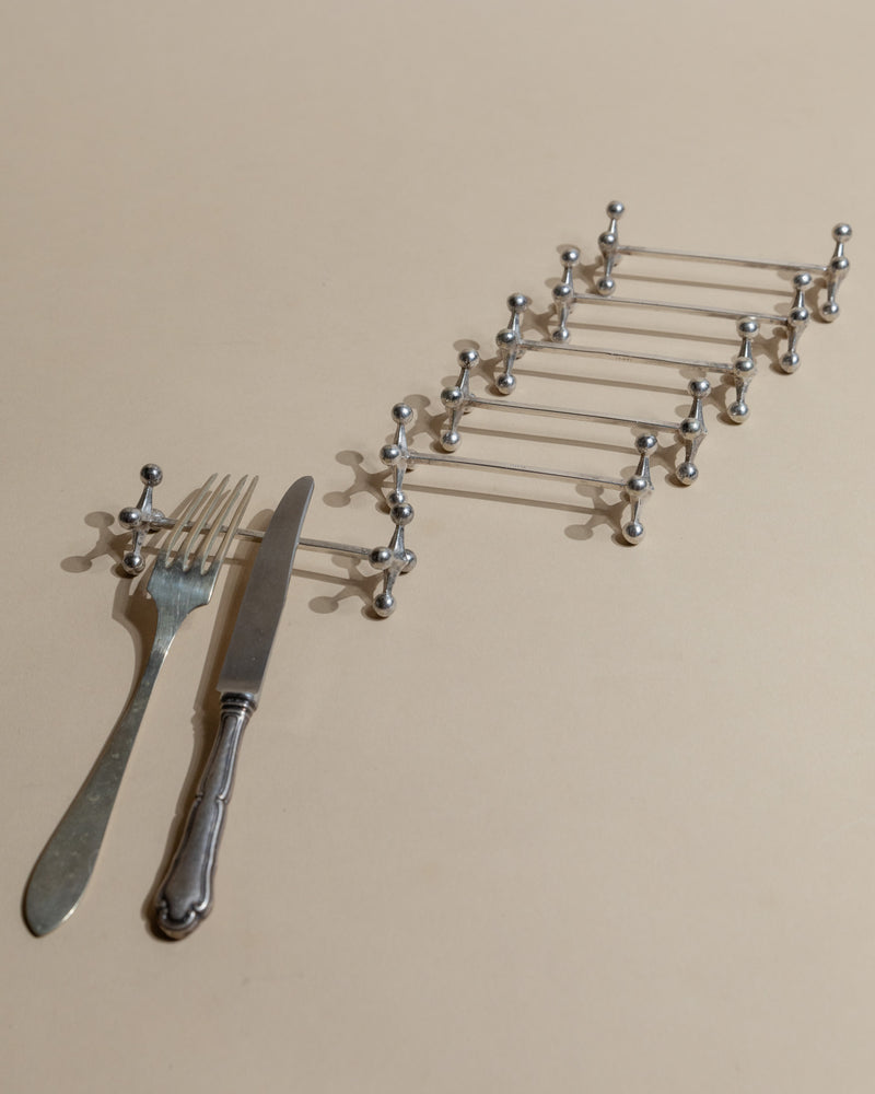 Six vintage silver-plated cutlery rests with ornate ball finials