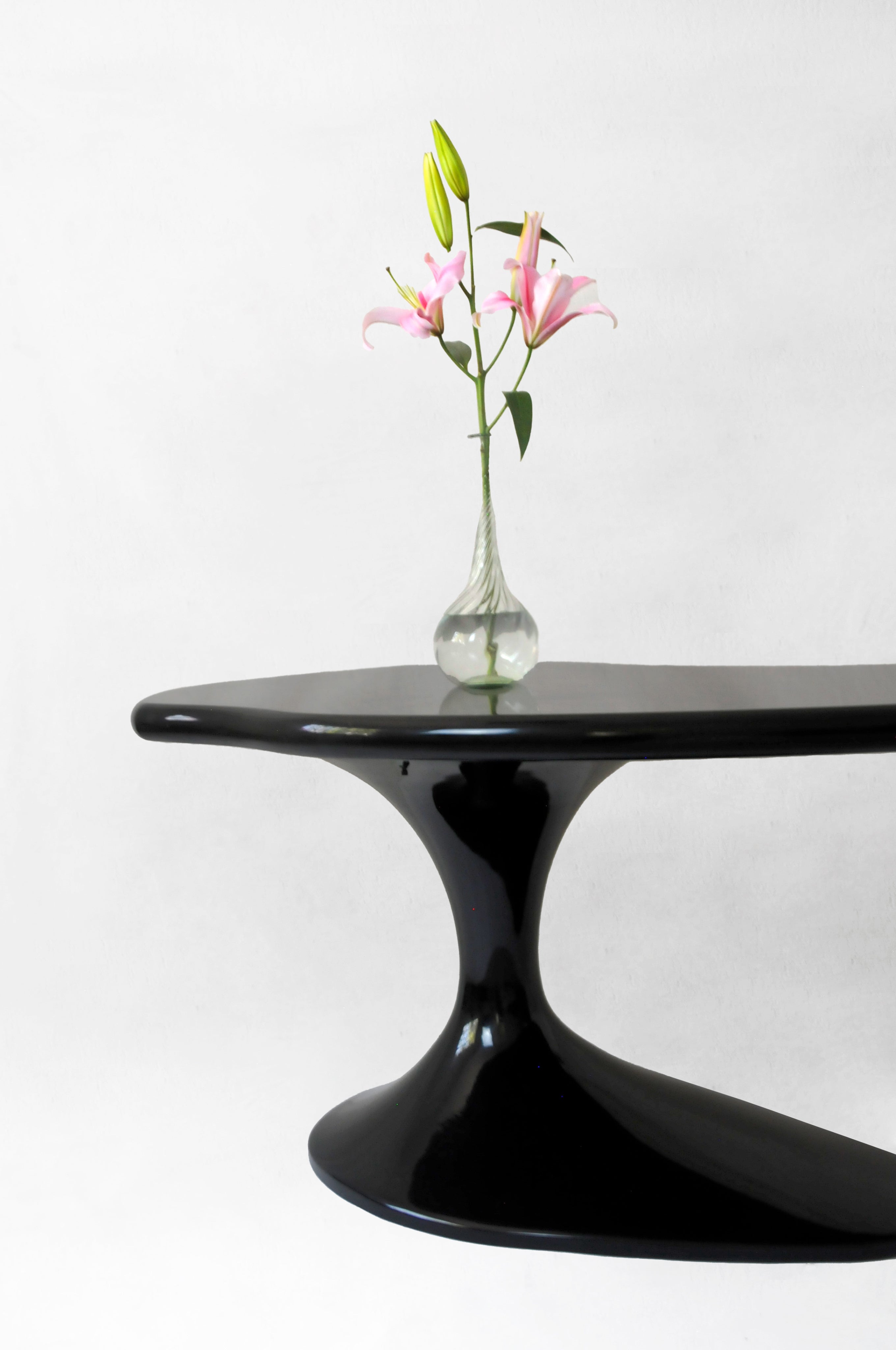Piano Desk in Lacqued Wood — side angle with floral arrangement on top