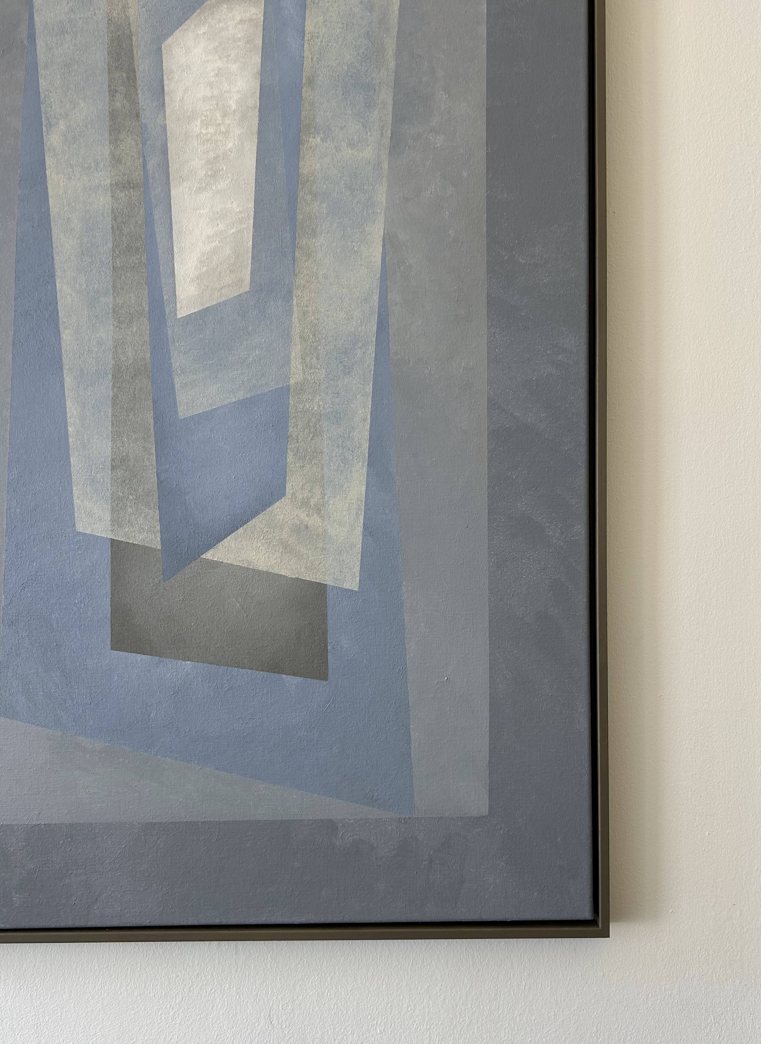 Floating" Painting by Iris Bavelaar: A contemporary framed artwork with overlapping gray, blue, and white geometric shapes that create a layered, tunnel-like effect, shown partially against a light wall.