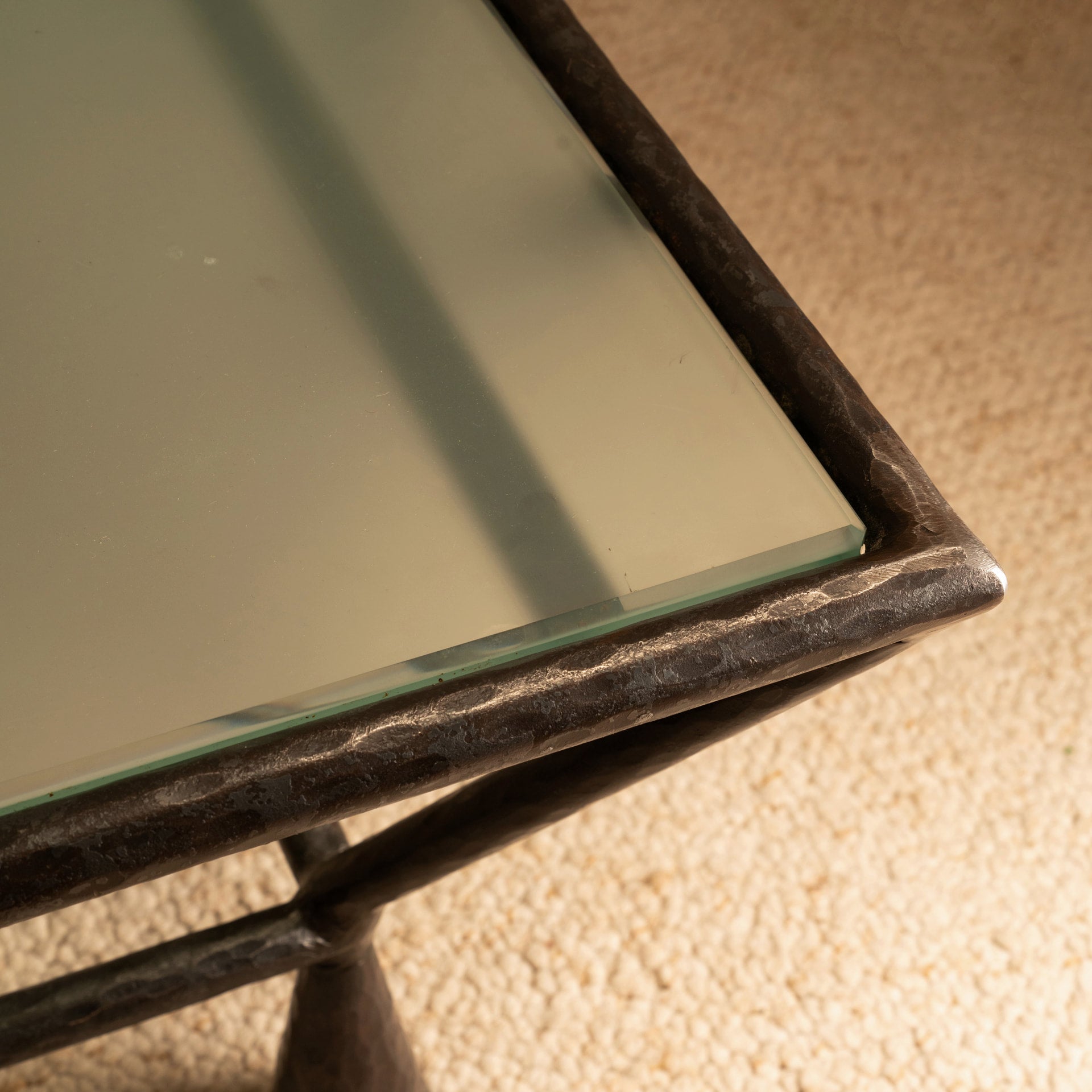 Zebra Coffee Table — angled view of glass top and metal frame
