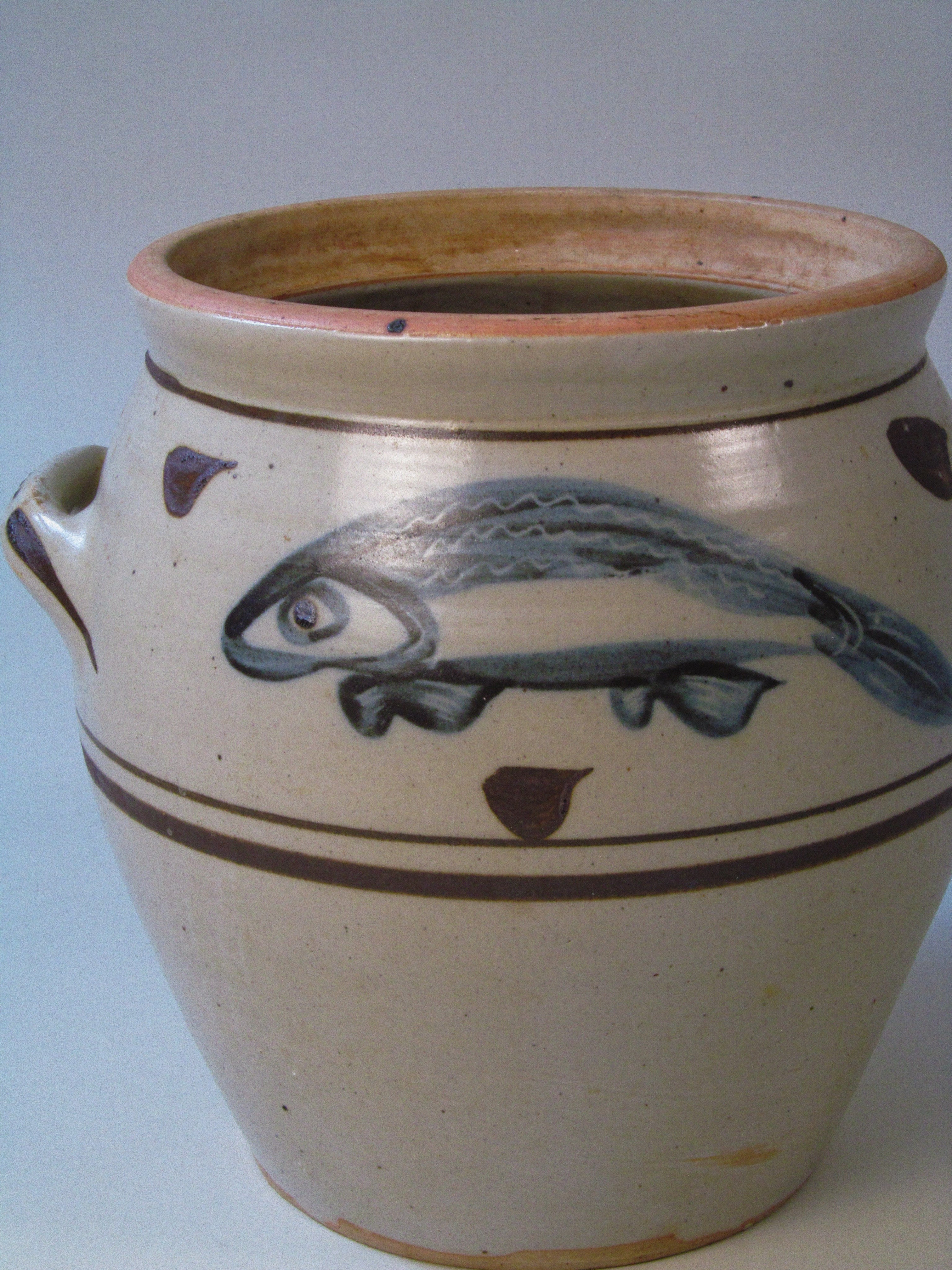 Large Slip-Decorated Stoneware Jar with Fish Motif — close-up showing fish design and earthy tones