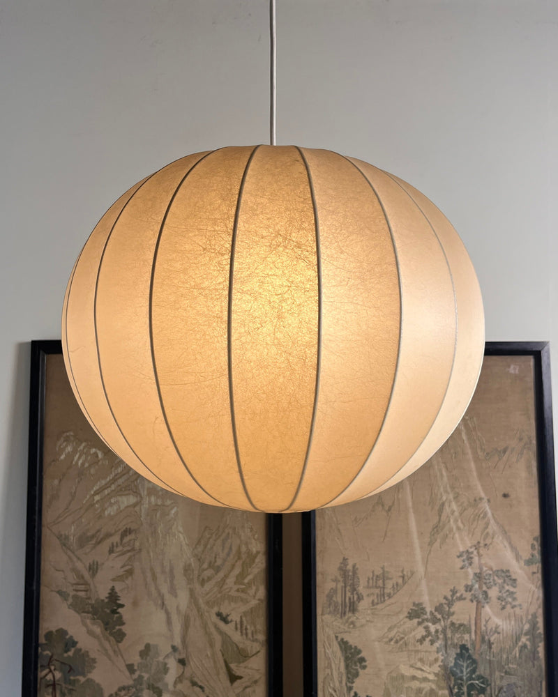 Large Italian cocoon pendant light with ribbed fabric shade illuminated