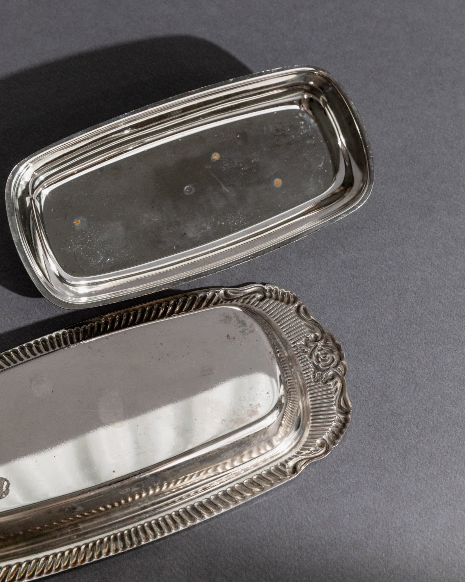 Previous slide Next slide Vintage 1970s Silver Plated Butter Dish, Engraved Ornamental — close-up of shiny silver surface wit