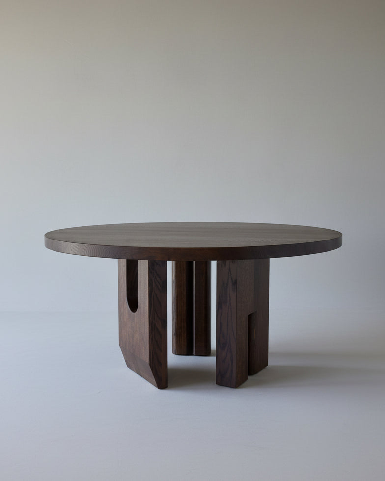 Tulia Round Dining Table by fern | The Oblist — dark wood, modern design