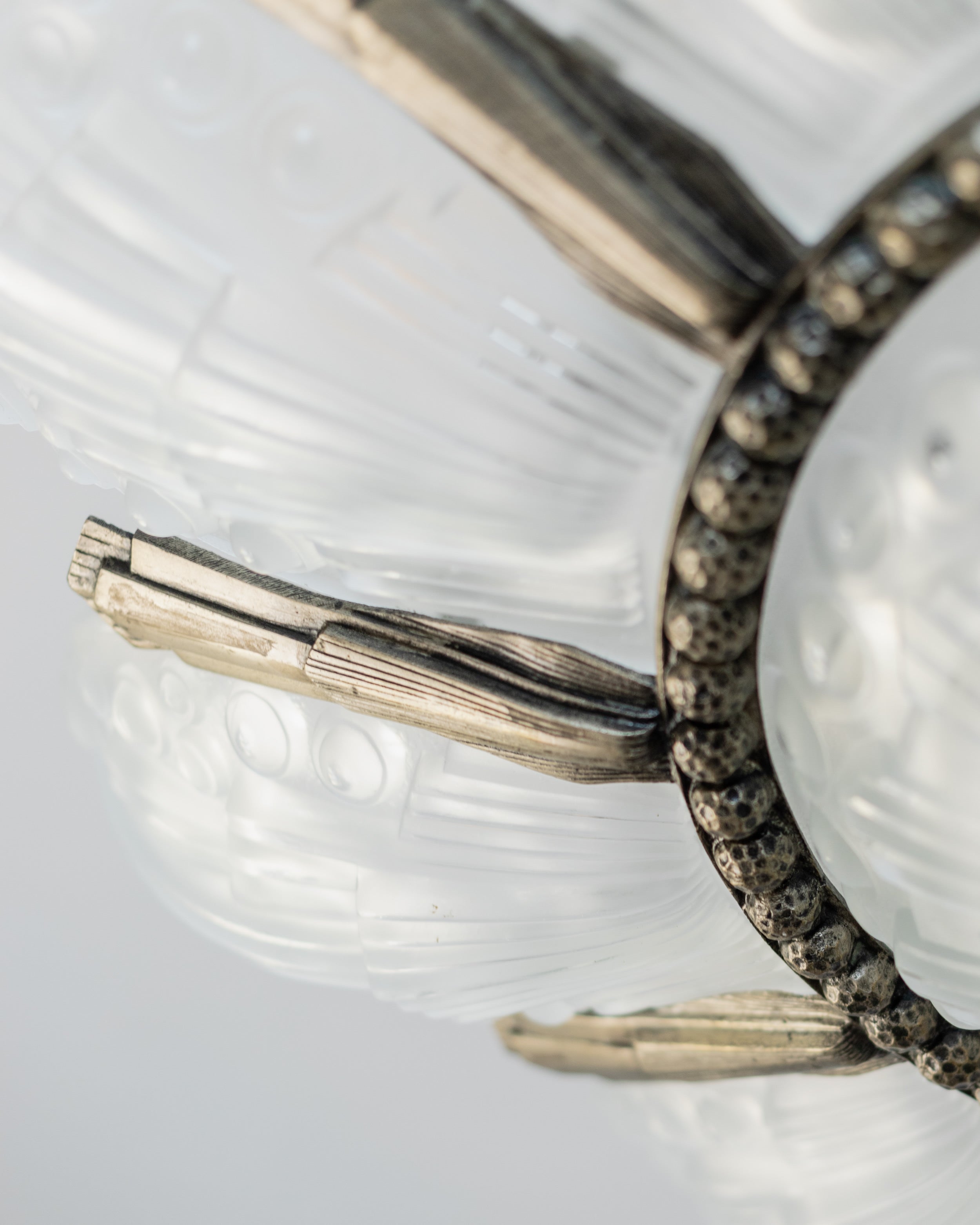 Crystal details and chrome mounting of 1930s Art Deco chandelier