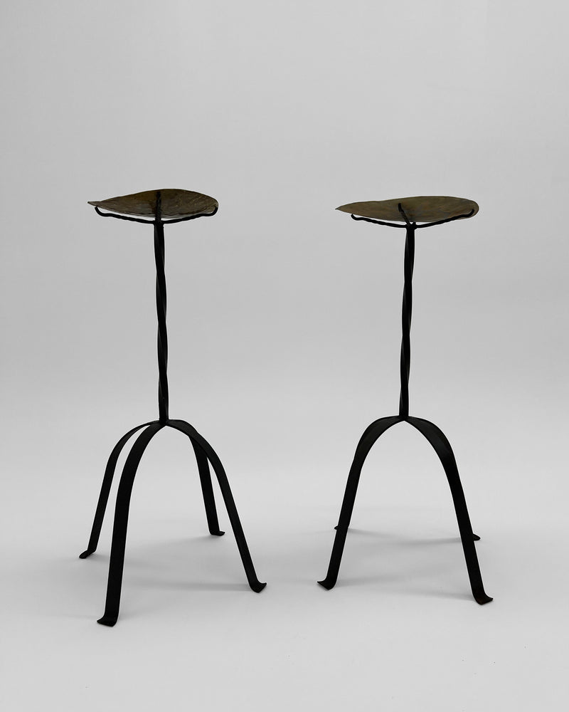 Pair of bronze candleholders with curved tripod legs by Camille Tan