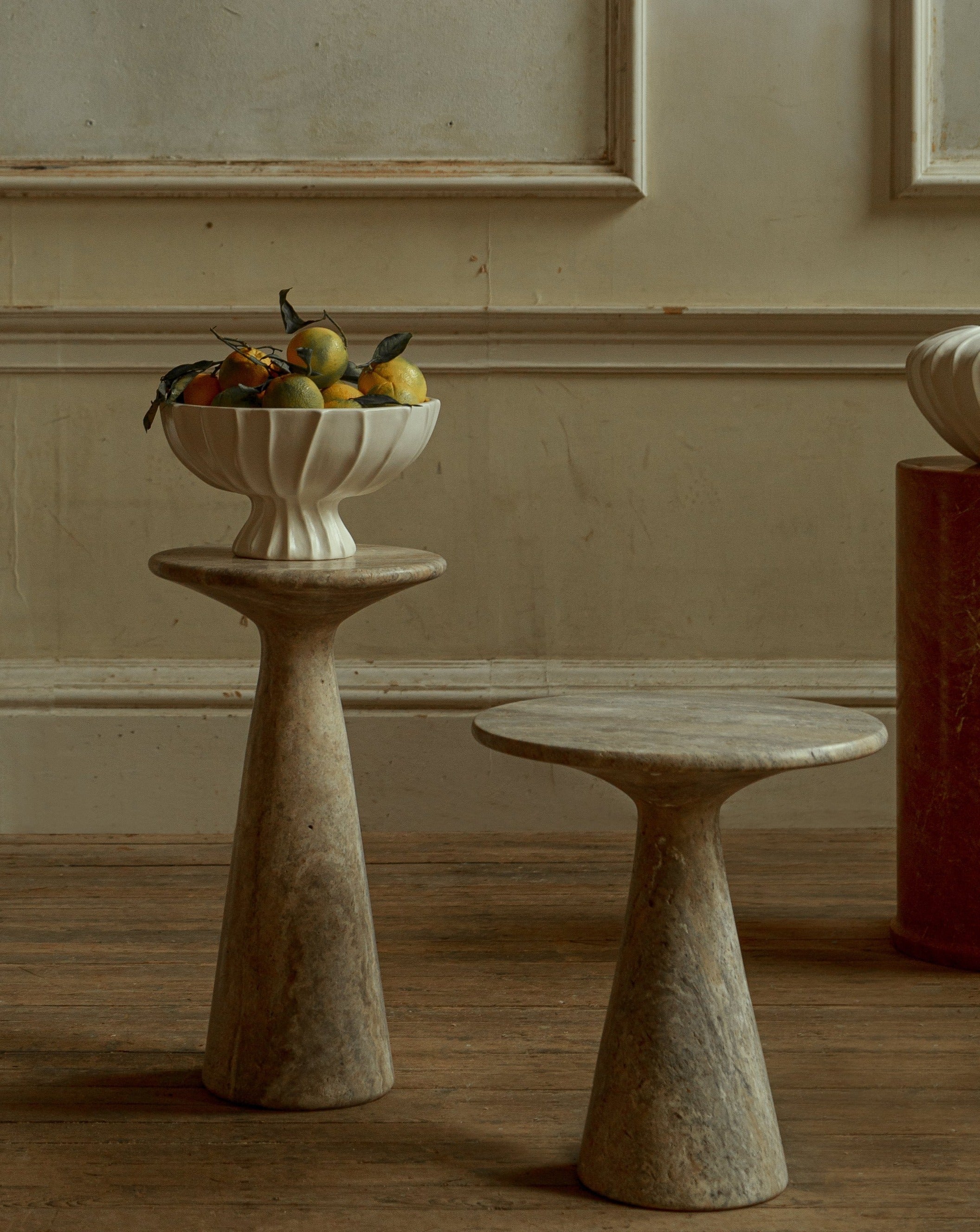 Juno Medium Travertine Side Table — lifestyle setting