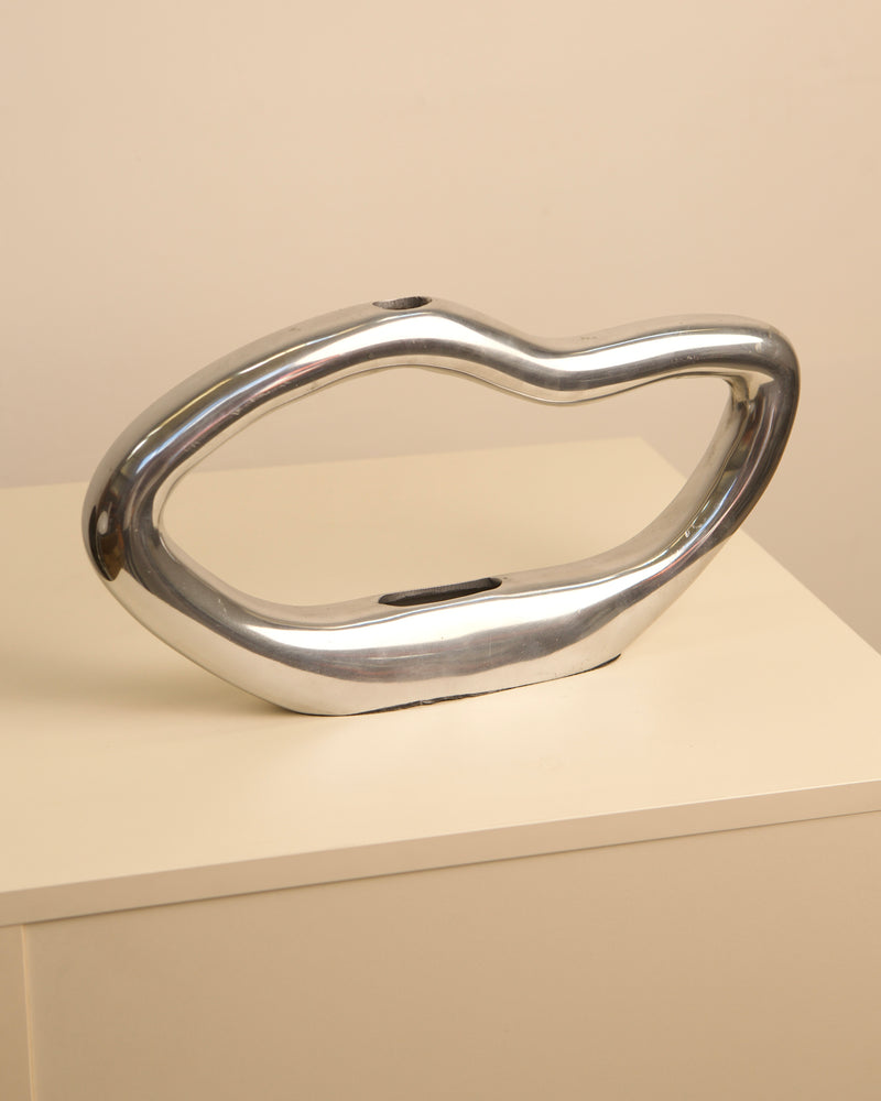 Onde chrome-finish sculptural vase with organic curved form 80s